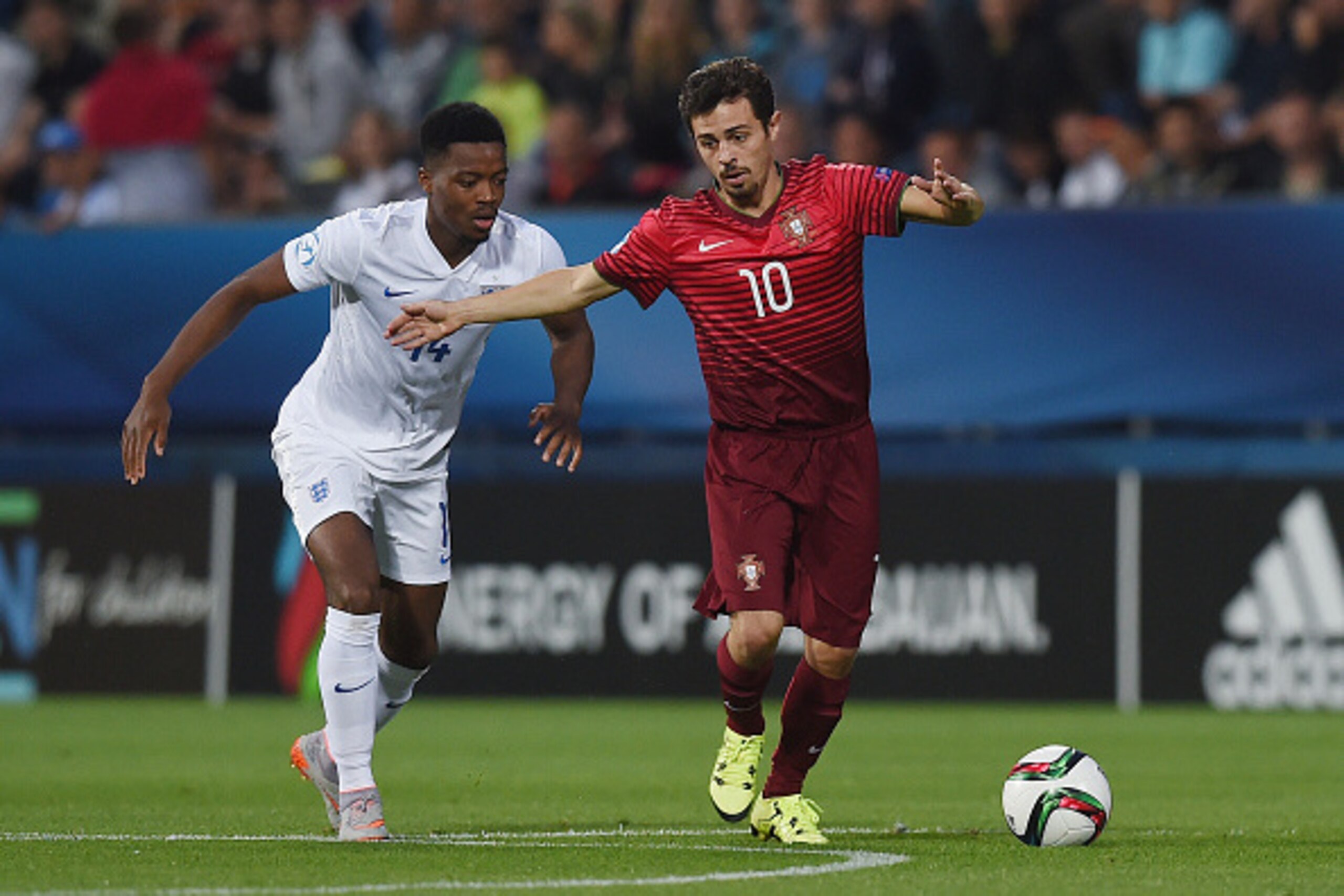 UHERSKE HRADISTE, CZECH REPUBLIC - JUNE 18: Nathaniel Chalobah of England in action with Bernardo Silva of Portugal during the UEFA Under21 European Championship 2015 Group B match between England and Portugal at Mestsky Fotbalovy Stadium on June 18, 2015