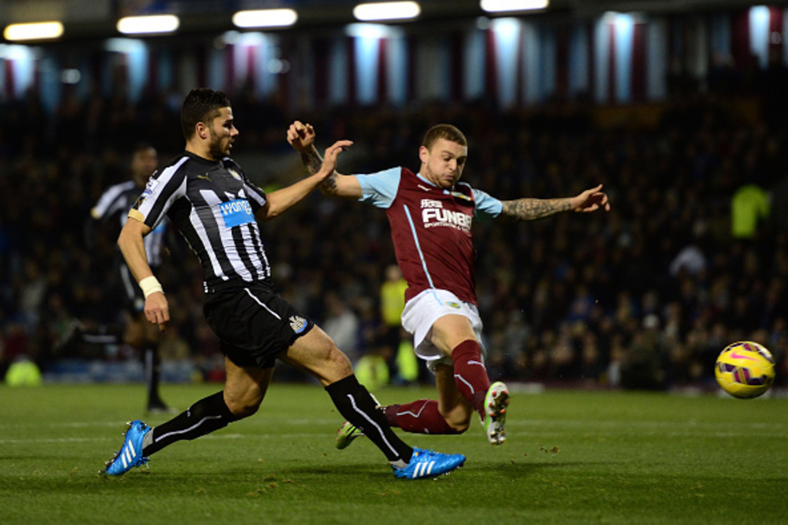 BURNLEY, ENGLAND - DECEMBER 02:  Mehdi Abeid of Newcastle United is challenged by Kieran Trippier of Burnley during the Barclays Premier League match between Burnley and Newcastle United at Turf Moor on December 2, 2014 in Burnley, England.  (Photo by Jam