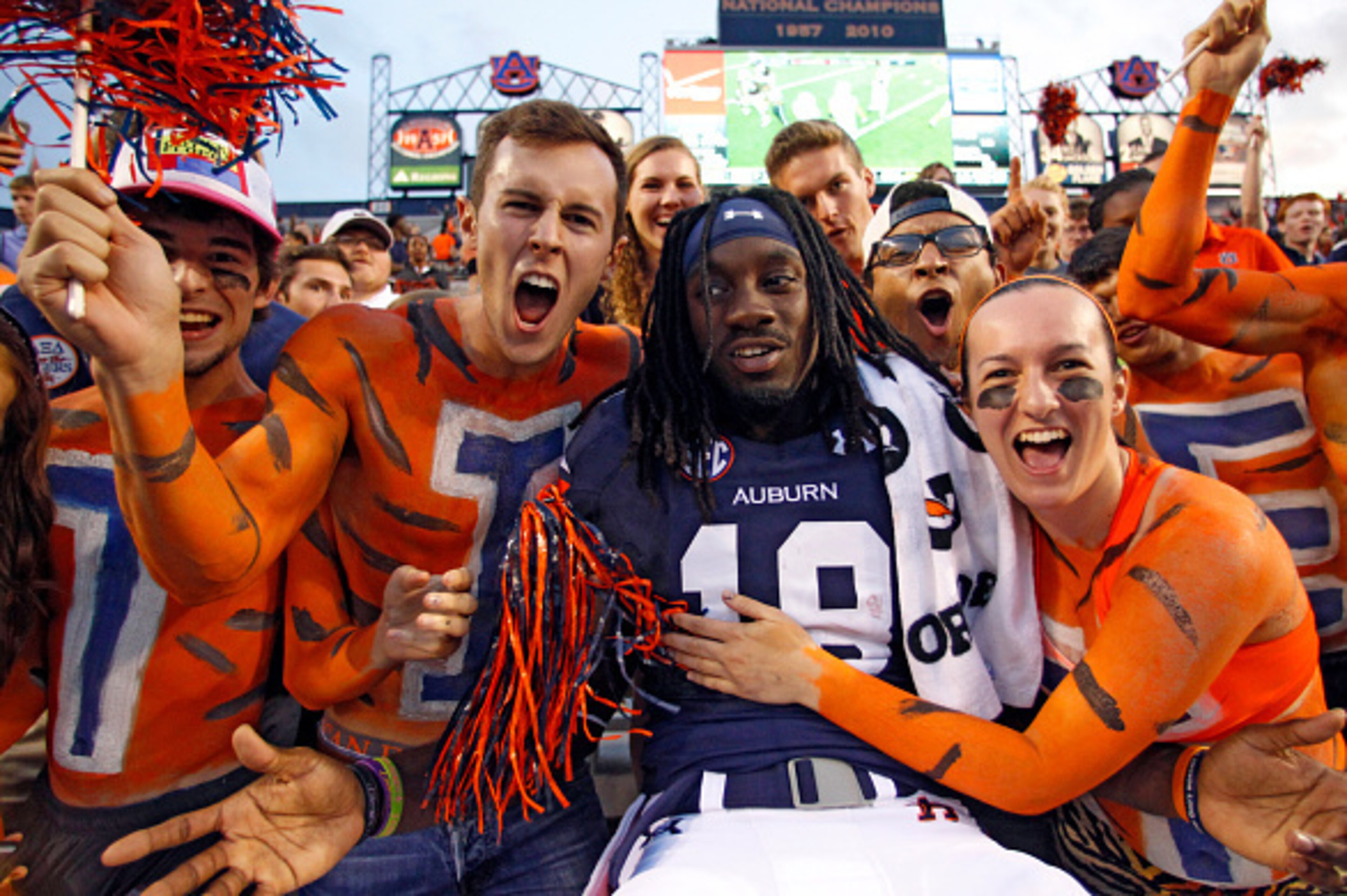 AUBURN, AL - SEPTEMBER 27:  Wide receiver Sammie Coates #18 of the Auburn Tigers celebrates with fans after they defeated the Louisiana Tech Bulldogs 45-17 at Jordan Hare Stadium on September 27, 2014 in Auburn, Alabama. (Photo by Butch Dill/Getty Images)
