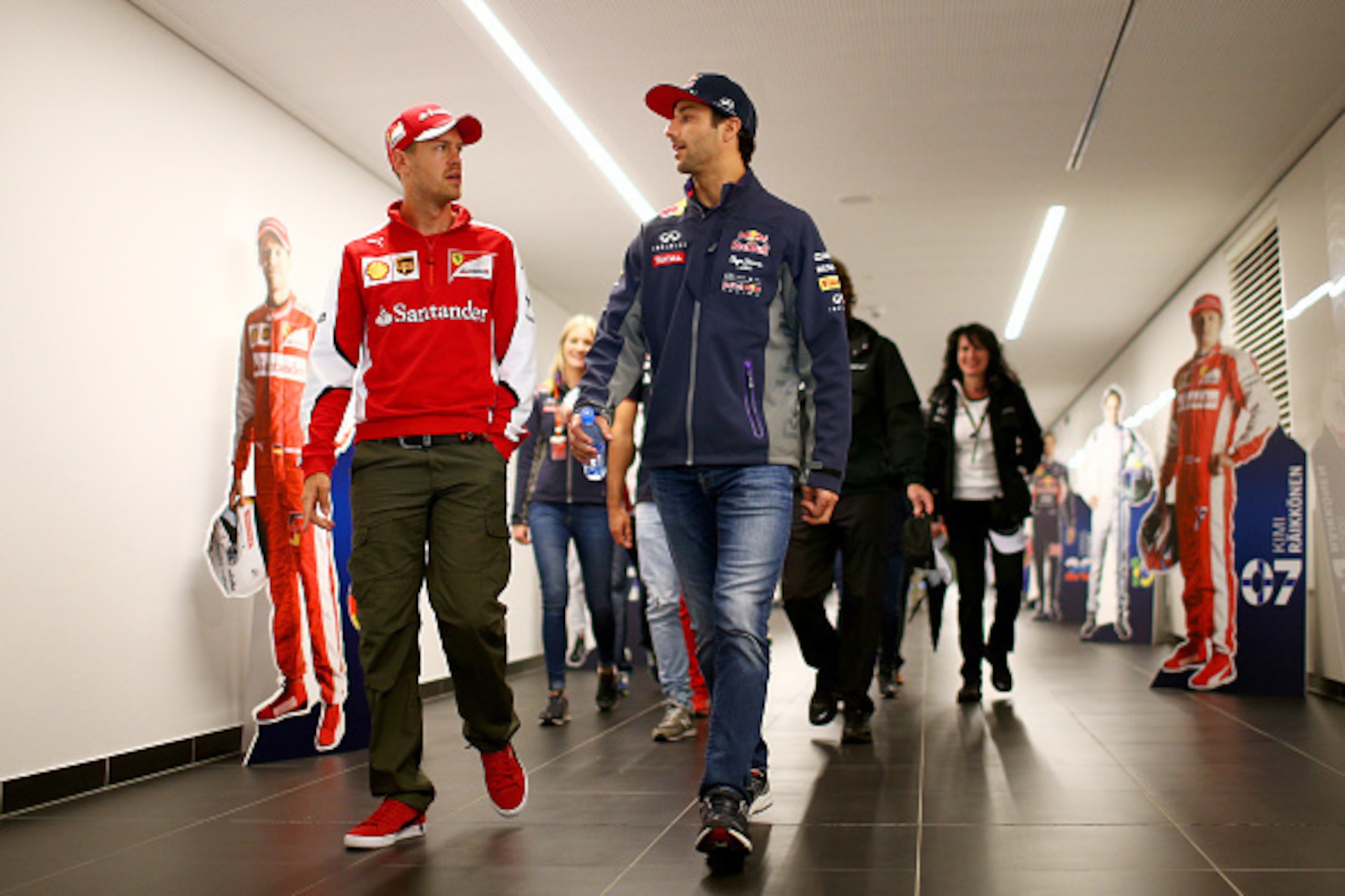SPIELBERG, AUSTRIA - JUNE 18:  Daniel Ricciardo of Australia and Infiniti Red Bull Racing speaks with Sebastian Vettel of Germany and Ferrari as they walk to a press conference during previews to the Formula One Grand Prix of Austria at Red Bull Ring on J