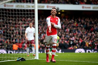 LONDON, ENGLAND - FEBRUARY 01:  Santi Cazorla of Arsenal celebrates after scoring his team's fourth goal from the penalty spot during the Barclays Premier League match between Arsenal and Aston Villa at the Emirates Stadium on February 1, 2015 in London, 