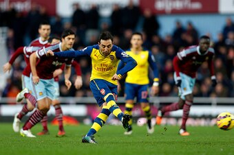 LONDON, ENGLAND - DECEMBER 28:  Santi Cazorla of Arsenal scores the opening goal from the penalty spot during the Barclays Premier League match between West Ham United and Arsenal at Boleyn Ground on December 28, 2014 in London, England.  (Photo by Steve 