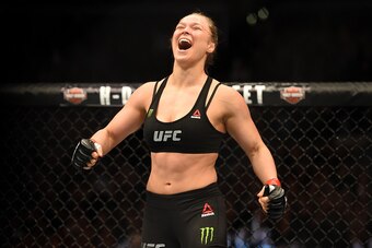 LOS ANGELES, CA - FEBRUARY 28:  Ronda Rousey celebrates her victory over Cat Zingano in their UFC women's bantamweight championship bout during the UFC 184 event at Staples Center on February 28, 2015 in Los Angeles, California.  (Photo by Harry How/Getty