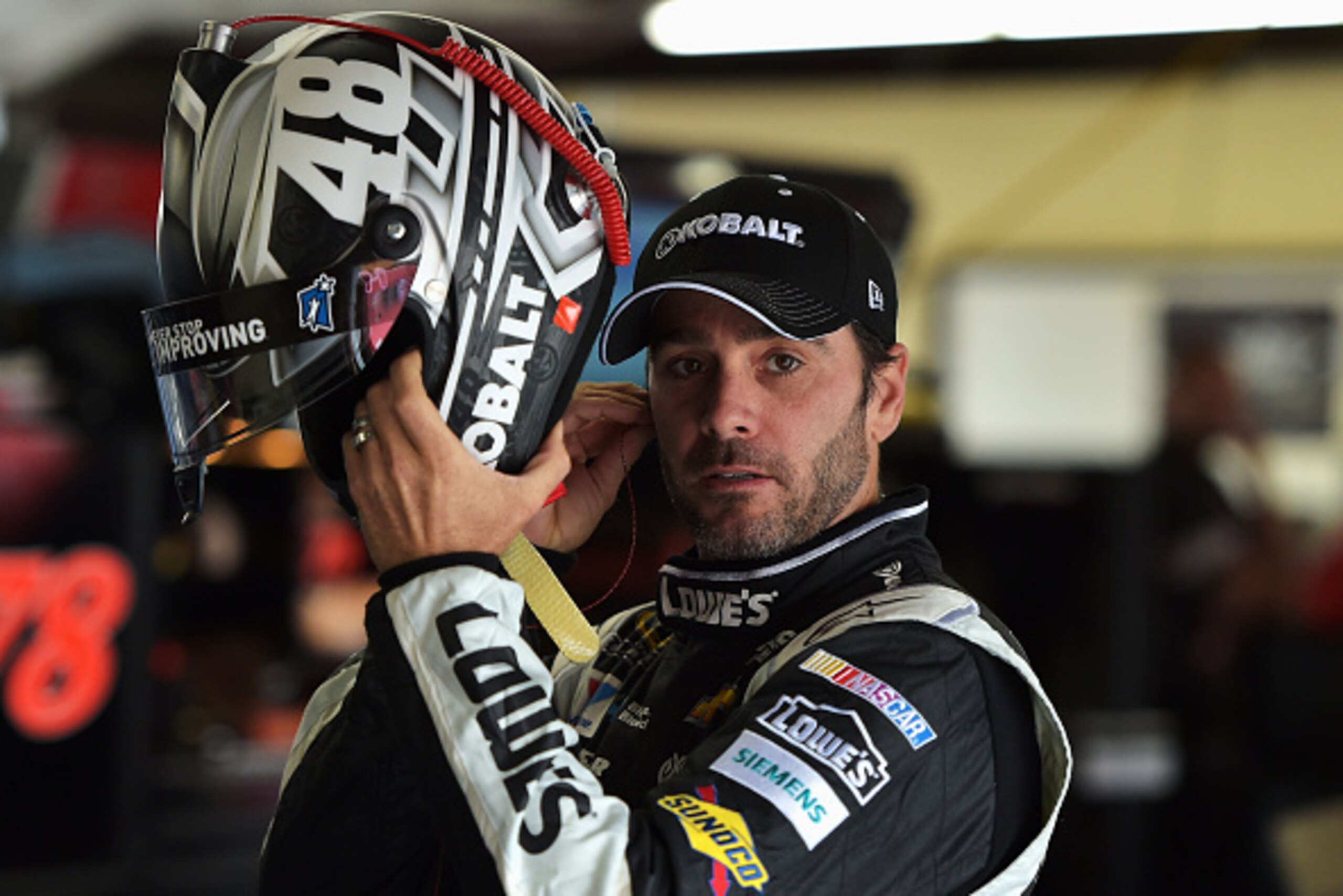 BROOKLYN, MI - JUNE 13: Jimmie Johnson, driver of the #48 KOBALT TOOLS Chevrolet, puts on his helmet during practice for the NASCAR Sprint Cup Series Quicken Loans 400 at Michigan International Speedway on June 13, 2015 in Brooklyn, Michigan. (Photo by BROOKLYN, MI - JUNE 13: Jimmie Johnson, driver of the #48 KOBALT TOOLS Chevrolet, puts on his helmet during practice for the NASCAR Sprint Cup Series Quicken Loans 400 at Michigan International Speedway on June 13, 2015 in Brooklyn, Michigan. (Photo by