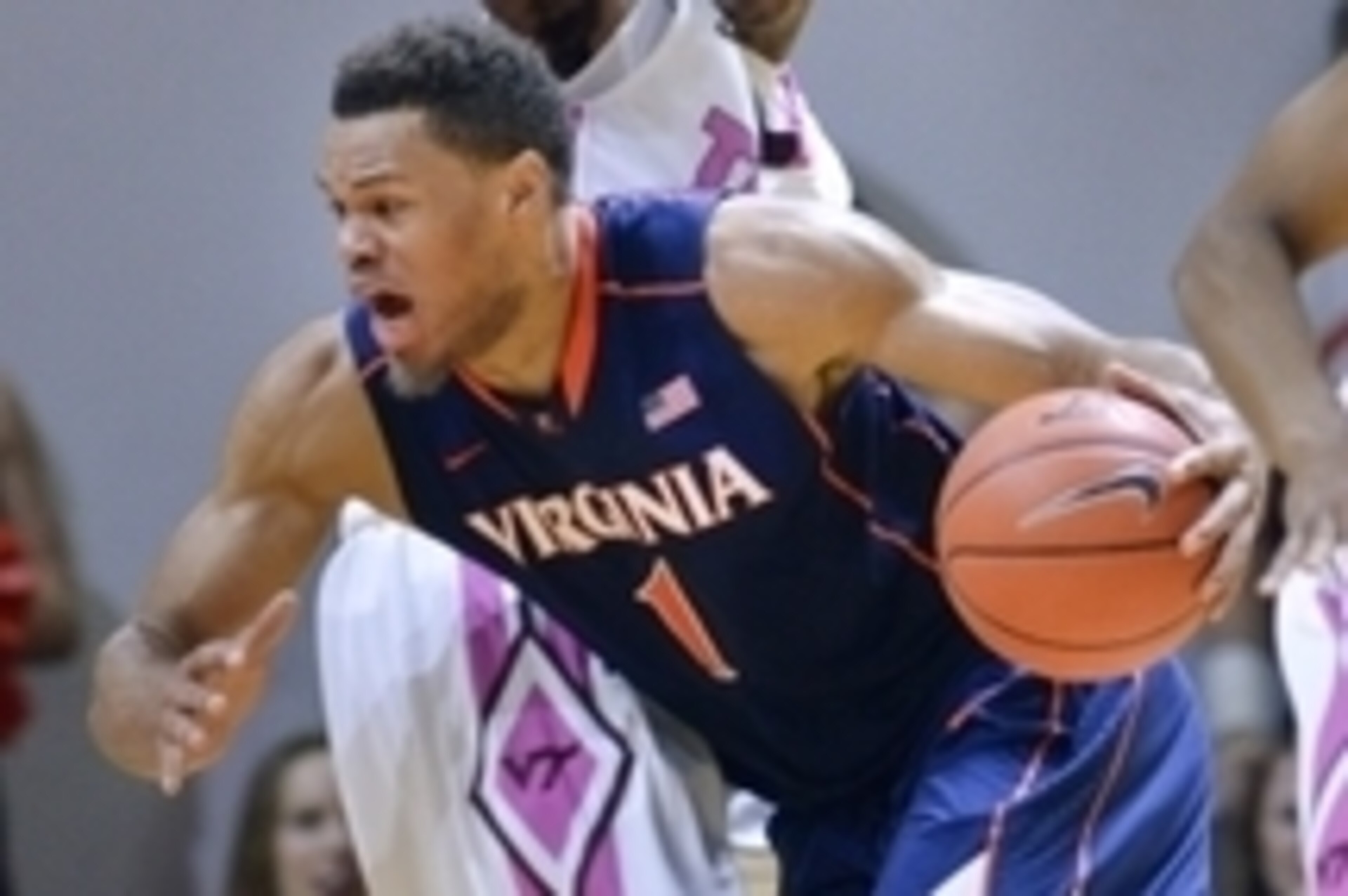 Jan 25, 2015; Blacksburg, VA, USA; Virginia Cavaliers guard Justin Anderson (1) drives to the basket past Virginia Tech Hokies guard Ahmed Hill (13) in the second half at Cassell Coliseum. Virginia defeated Virginia Tech 50-47. Mandatory Credit: Michael S