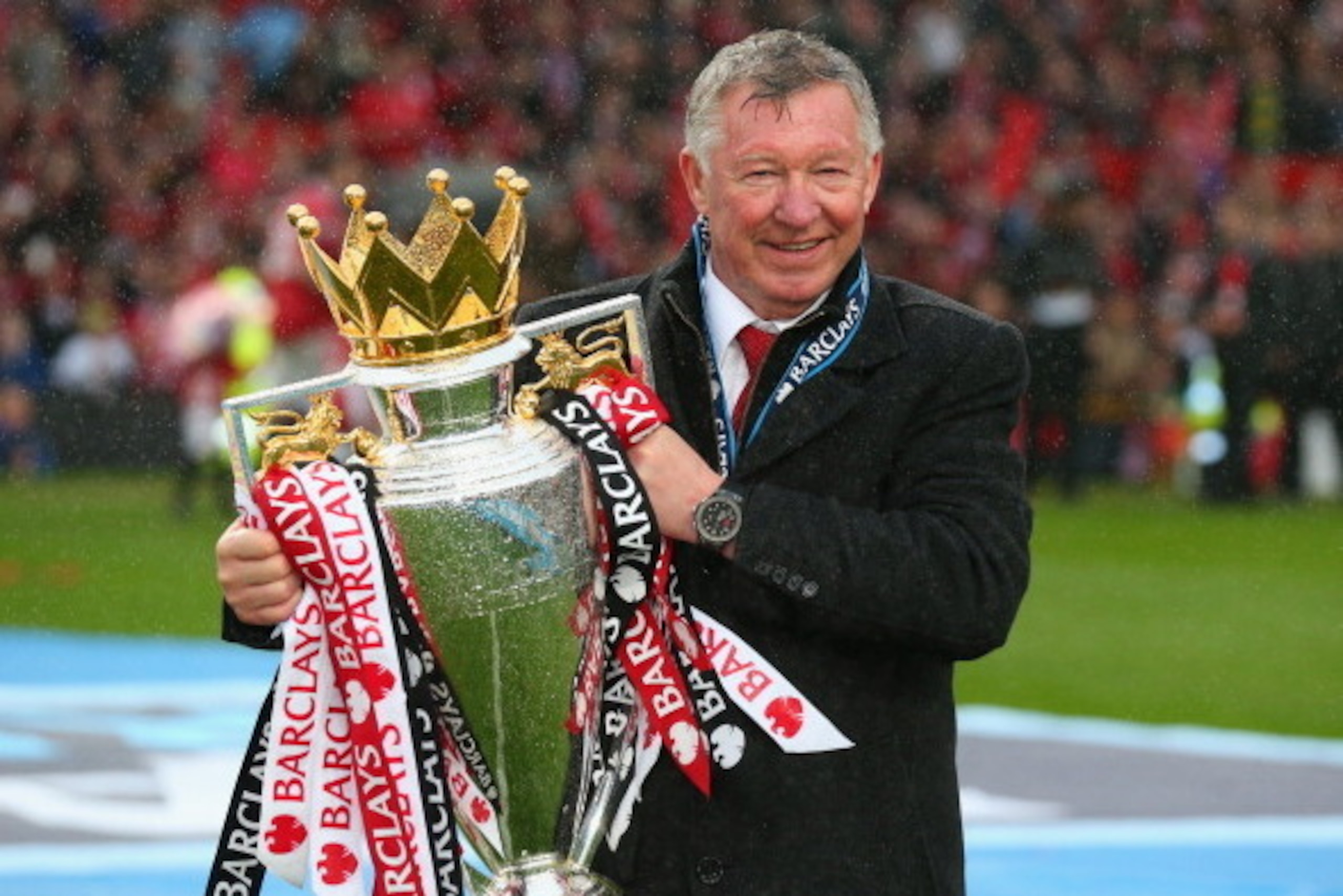 MANCHESTER, ENGLAND - MAY 12:  Manchester United Manager Sir Alex Ferguson celebrates with the Premier League trophy following the Barclays Premier League match between Manchester United and Swansea City at Old Trafford on May 12, 2013 in Manchester, Engl