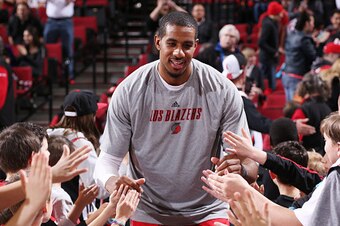 PORTLAND, OR - MARCH 5: LaMarcus Aldridge #12 of the Portland Trail Blazers gets introduced before a game against the Dallas Mavericks on March 5, 2015 at the Moda Center Arena in Portland, Oregon. NOTE TO USER: User expressly acknowledges and agrees that