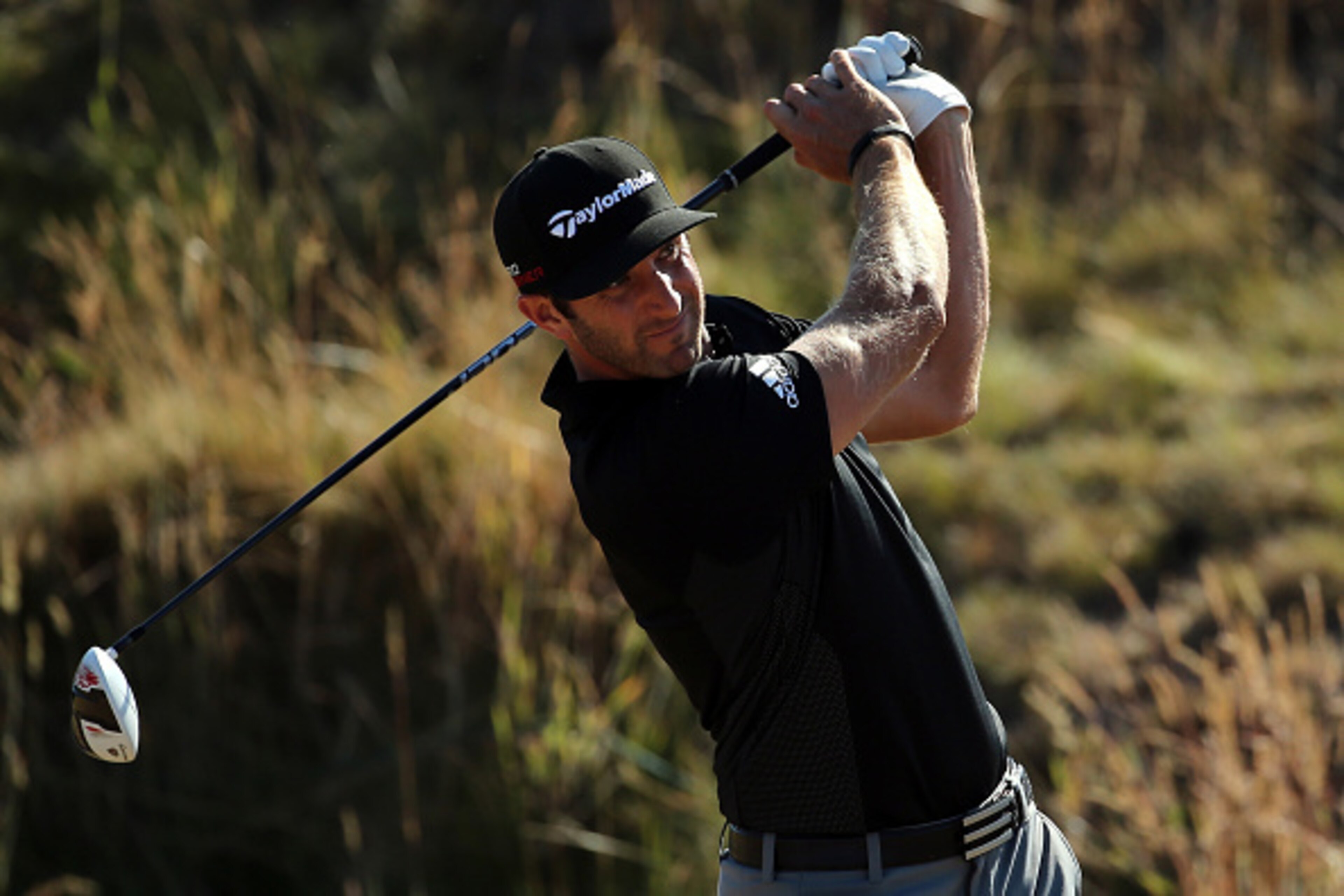 UNIVERSITY PLACE, WA - JUNE 19:  Dustin Johnson of the United States watches his tee shot on the 11th hole during the second round of the 115th U.S. Open Championship at Chambers Bay on June 19, 2015 in University Place, Washington.  (Photo by Mike Ehrman