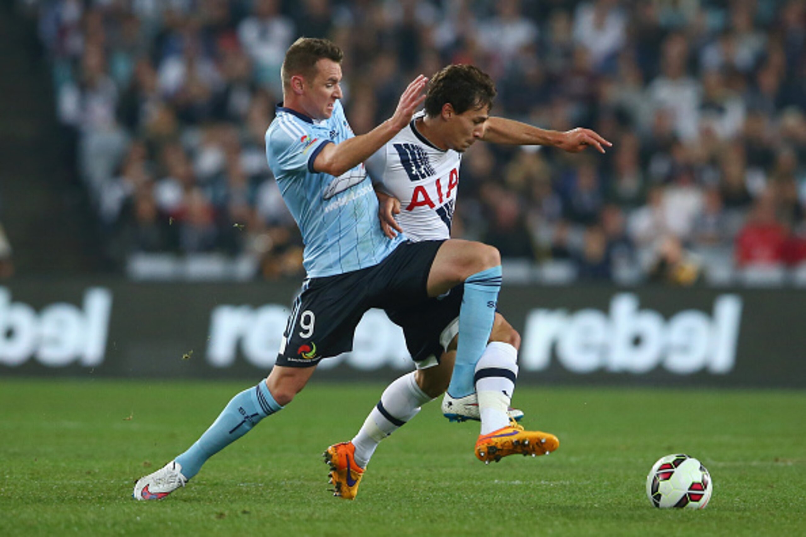 SYDNEY, AUSTRALIA - MAY 30:  Shane Smeltz of Sydney FC and Benjamin Stambouli of Tottenham Hotspur compete for the ball during the international friendly match between Sydney FC and Tottenham Spurs at ANZ Stadium on May 30, 2015 in Sydney, Australia.  (Ph