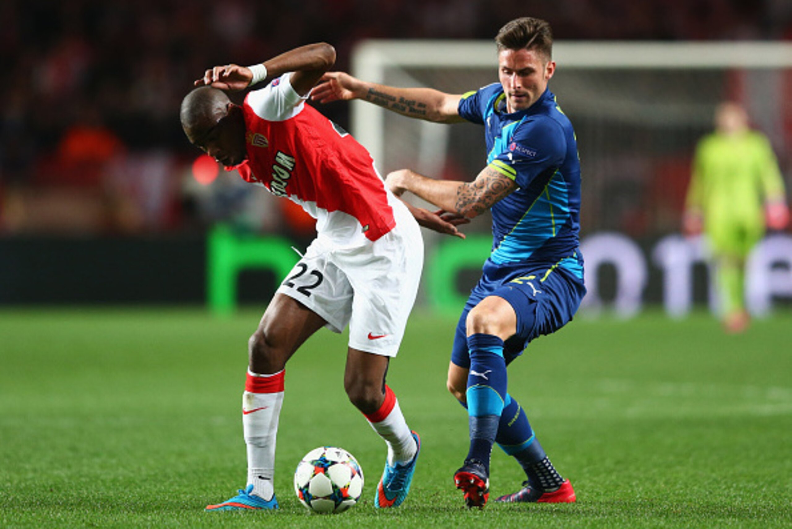 MONACO - MARCH 17:  Geoffrey Kondogbia of Monaco holds off Olivier Giroud of Arsenal during the UEFA Champions League round of 16 second leg match between AS Monaco and Arsenal at Stade Louis II on March 17, 2015 in Monaco, Monaco.  (Photo by Michael Stee