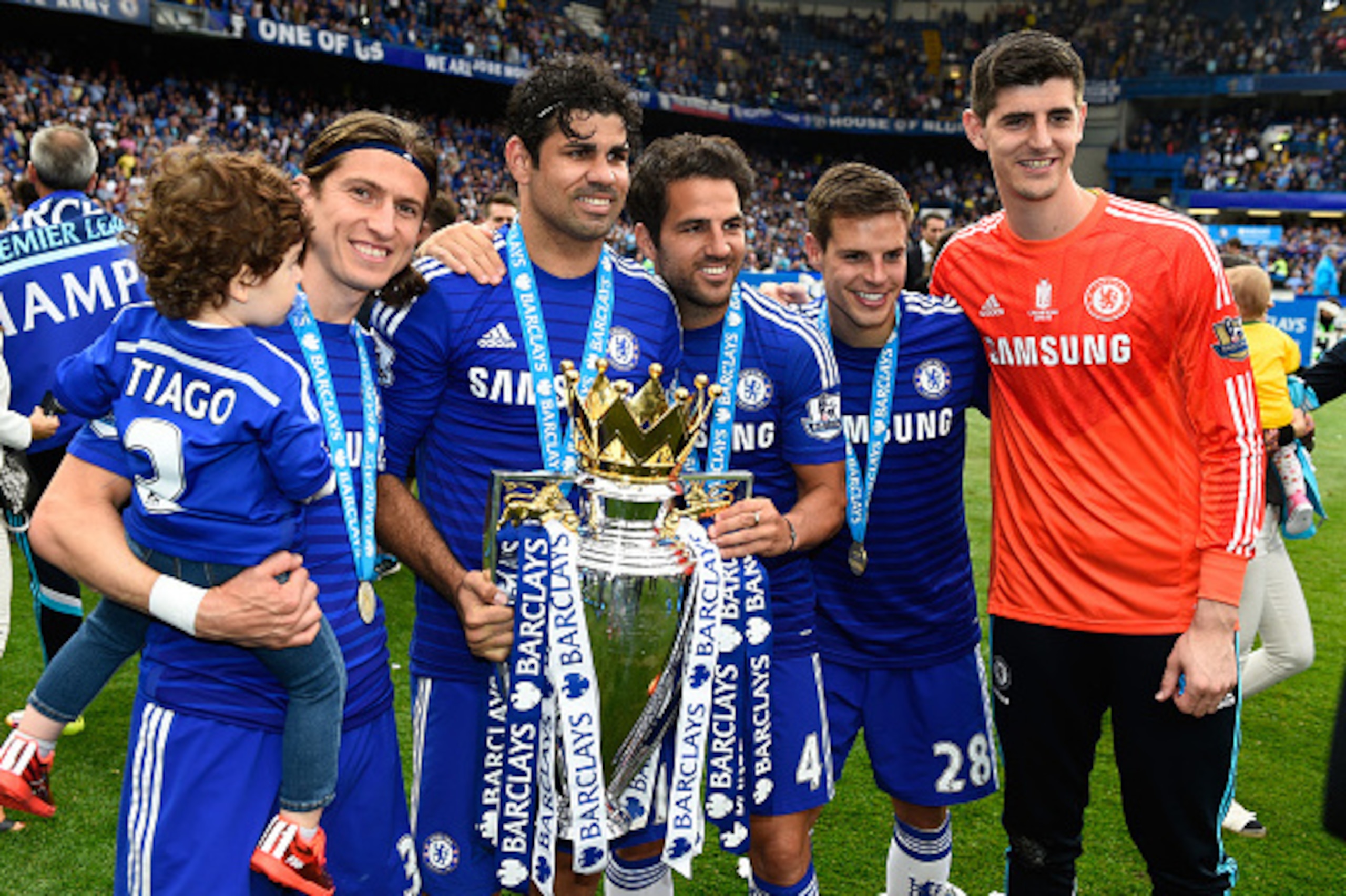 LONDON, ENGLAND - MAY 24:  (L-R) Filipe Luis, Diego Costa, Cesc Fabregas, Cesar Azpilicueta and Thibaut Courtois of Chelsea celebrate with the trophy after the Barclays Premier League match between Chelsea and Sunderland at Stamford Bridge on May 24, 2015