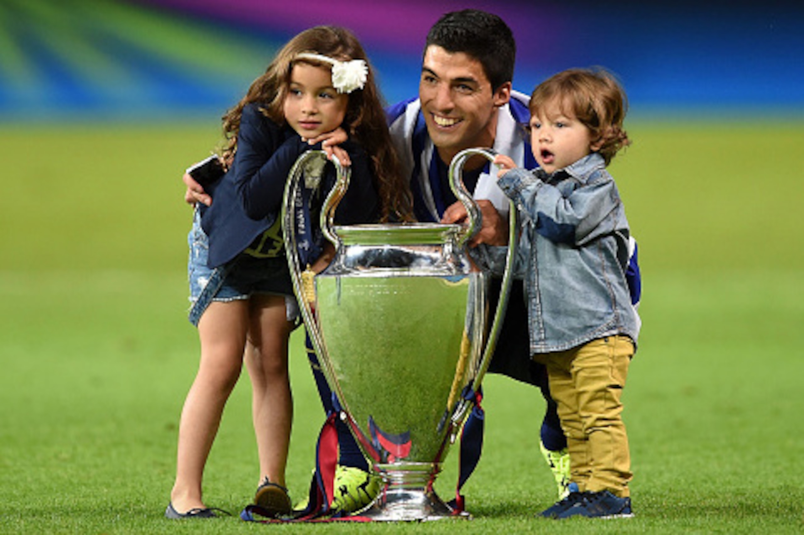BERLIN, GERMANY - JUNE 06:  Luis Suarez of Barcelona celebrates with the trophy and daughter Delfina and son Benjamin after the UEFA Champions League Final between Juventus and FC Barcelona at Olympiastadion on June 6, 2015 in Berlin, Germany.  (Photo by 