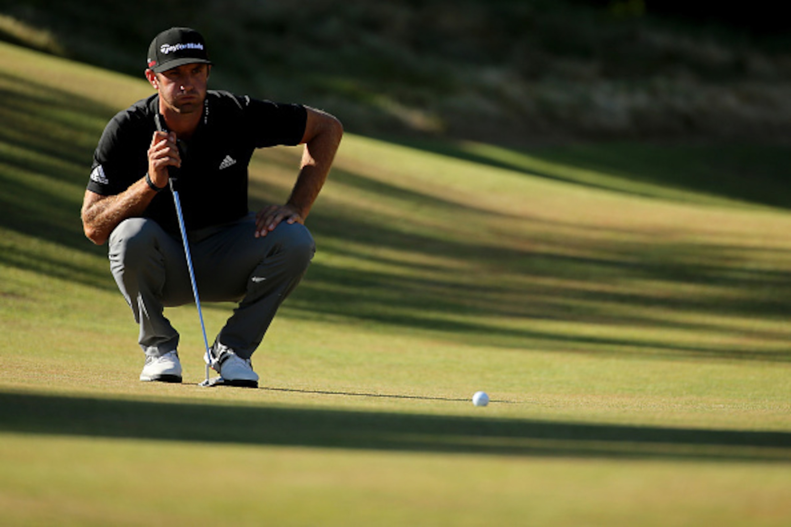 UNIVERSITY PLACE, WA - JUNE 19:  Dustin Johnson of the United States waits on the 12th green during the second round of the 115th U.S. Open Championship at Chambers Bay on June 19, 2015 in University Place, Washington.  (Photo by Mike Ehrmann/Getty Images