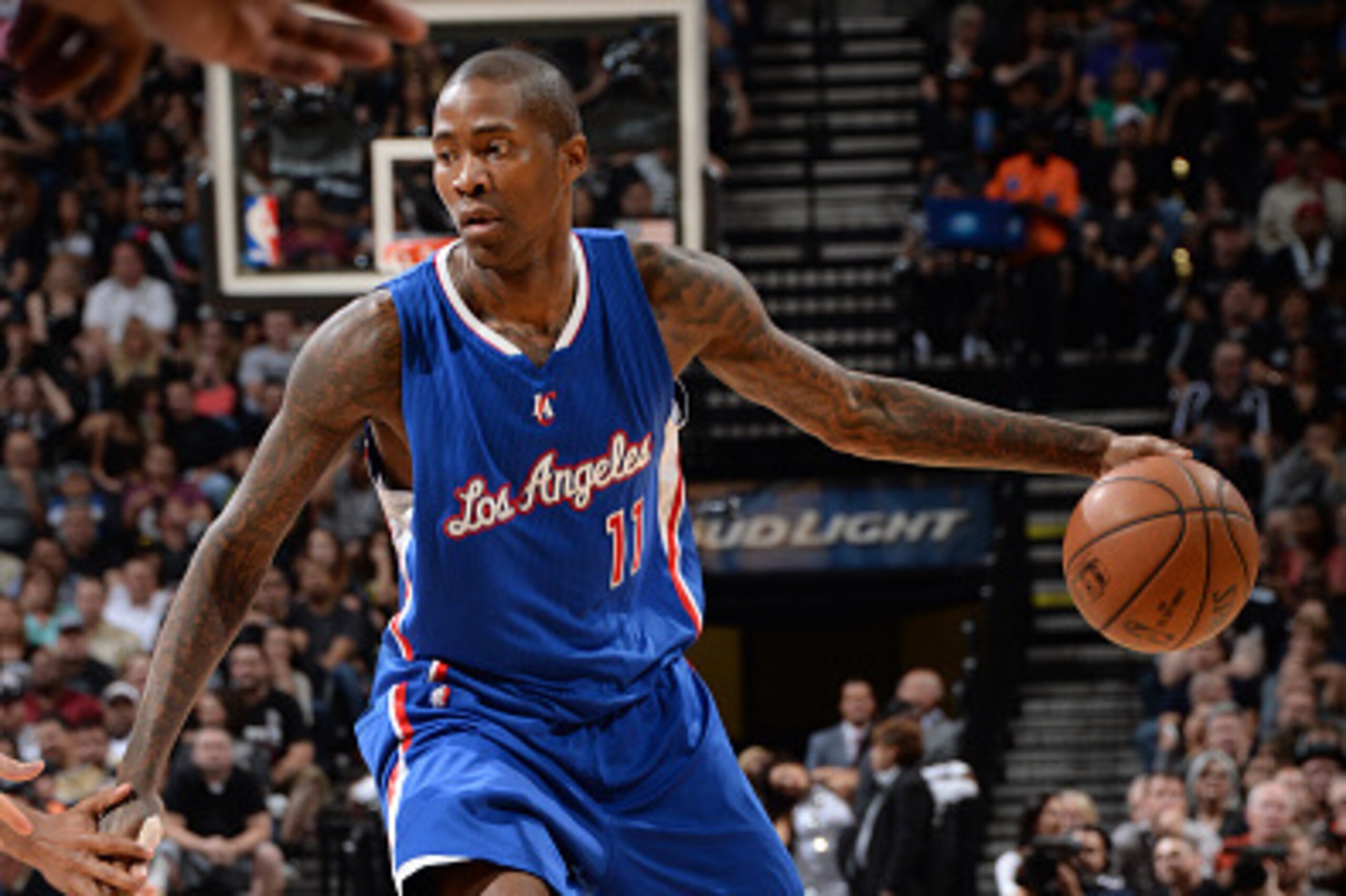 SAN ANTONIO, TEXAS - April 30: Jamal Crawford #11 of the Los Angeles Clippers looks to move the ball against the San Antonio Spurs during Game Six of the Western Conference Quarterfinals during the NBA Playoffs on April 30, 2015 at Barclays Center in San 
