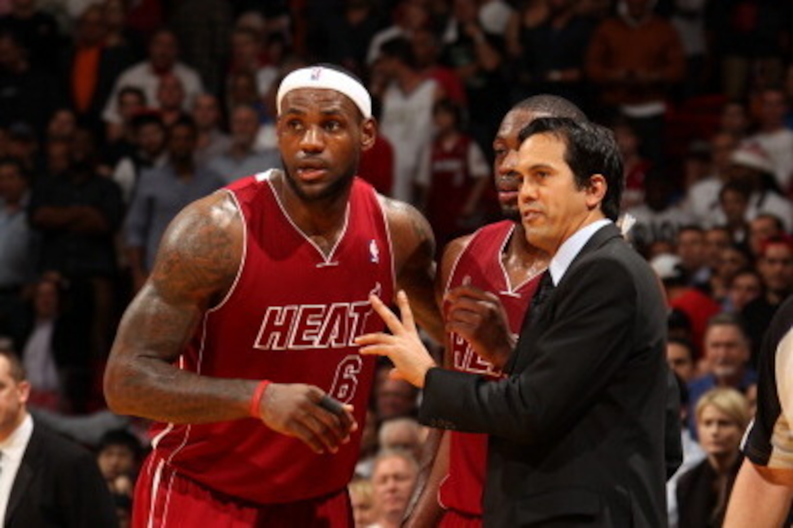 MIAMI, FL - DECEMBER 18: Erik Spoelstra of the Miami Heat shares a word with LeBron James #6 during the game the game against the Indiana Pacers on December 18, 2013 at American Airlines Arena in Miami, Florida. NOTE TO USER: User expressly acknowledges a