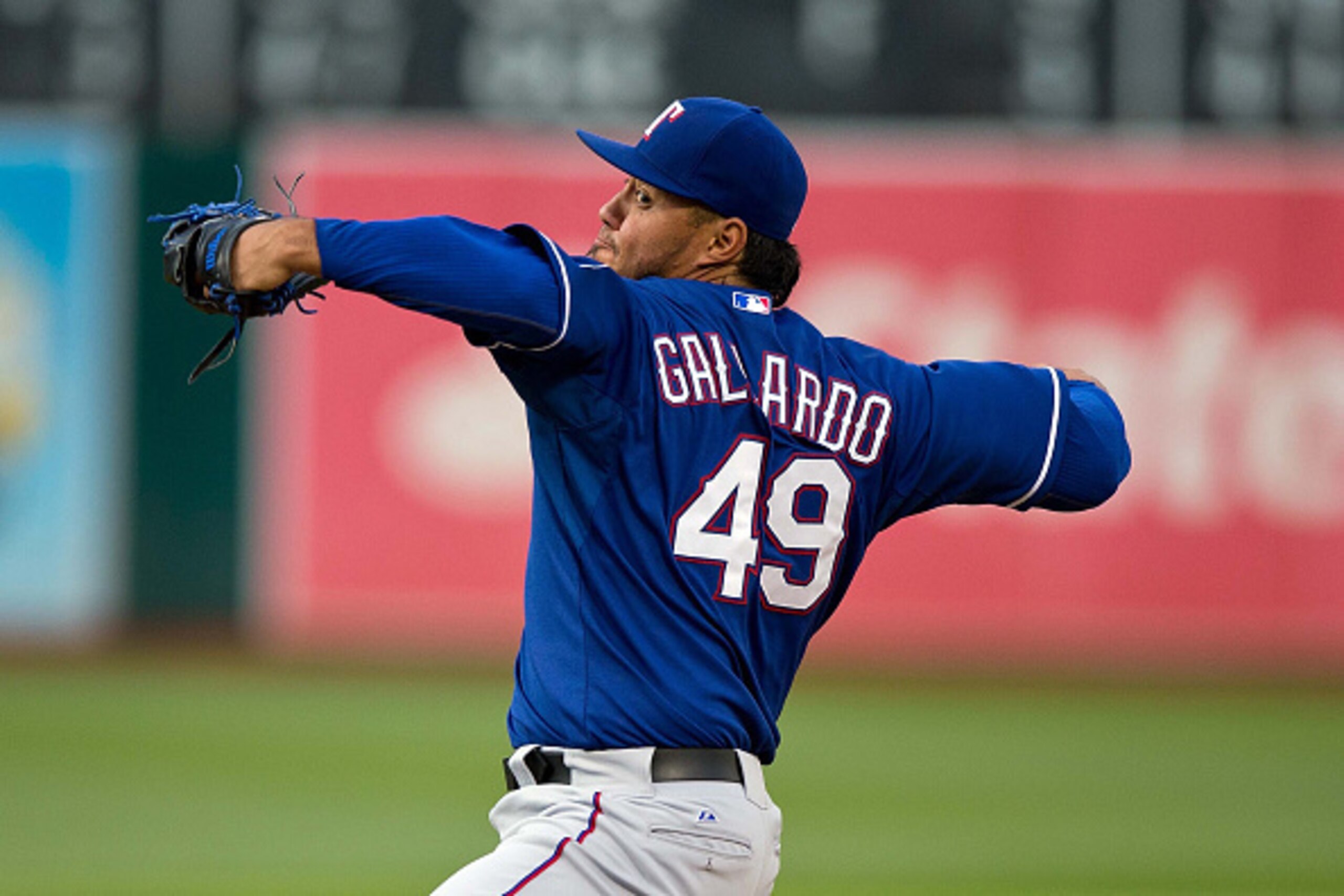 OAKLAND, CA - JUNE 10: Yovani Gallardo #49 of the Texas Rangers pitches against the Oakland Athletics during the first inning at O.co Coliseum on June 10, 2015 in Oakland, California. (Photo by Jason O. Watson/Getty Images) OAKLAND, CA - JUNE 10: Yovani Gallardo #49 of the Texas Rangers pitches against the Oakland Athletics during the first inning at O.co Coliseum on June 10, 2015 in Oakland, California. (Photo by Jason O. Watson/Getty Images)