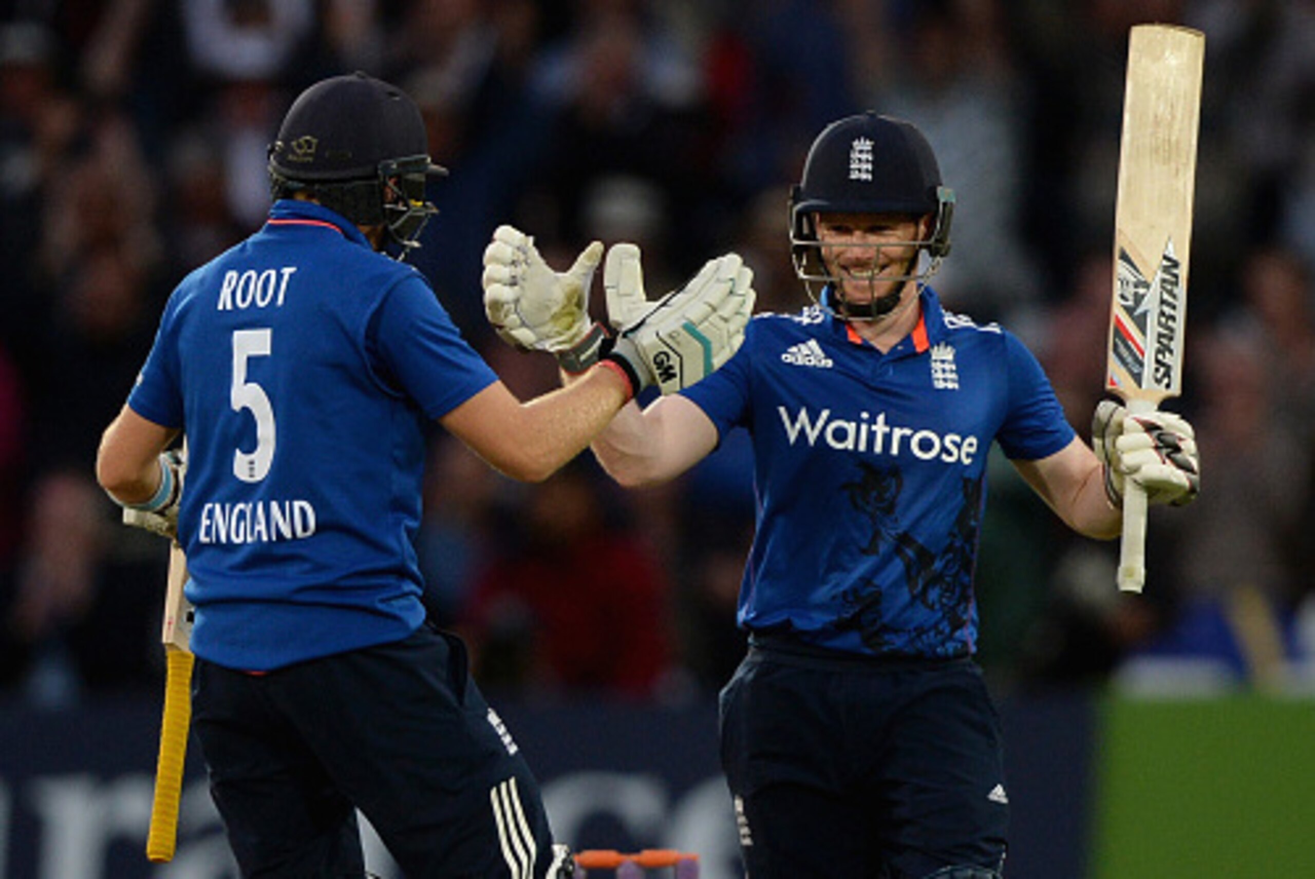NOTTINGHAM, ENGLAND - JUNE 17:  England captain Eoin Morgan celebrates with Joe Root after reaching his century during the 4th ODI Royal London One-Day match between England and New Zealand at Trent Bridge on June 17, 2015 in Nottingham, England.  (Photo 
