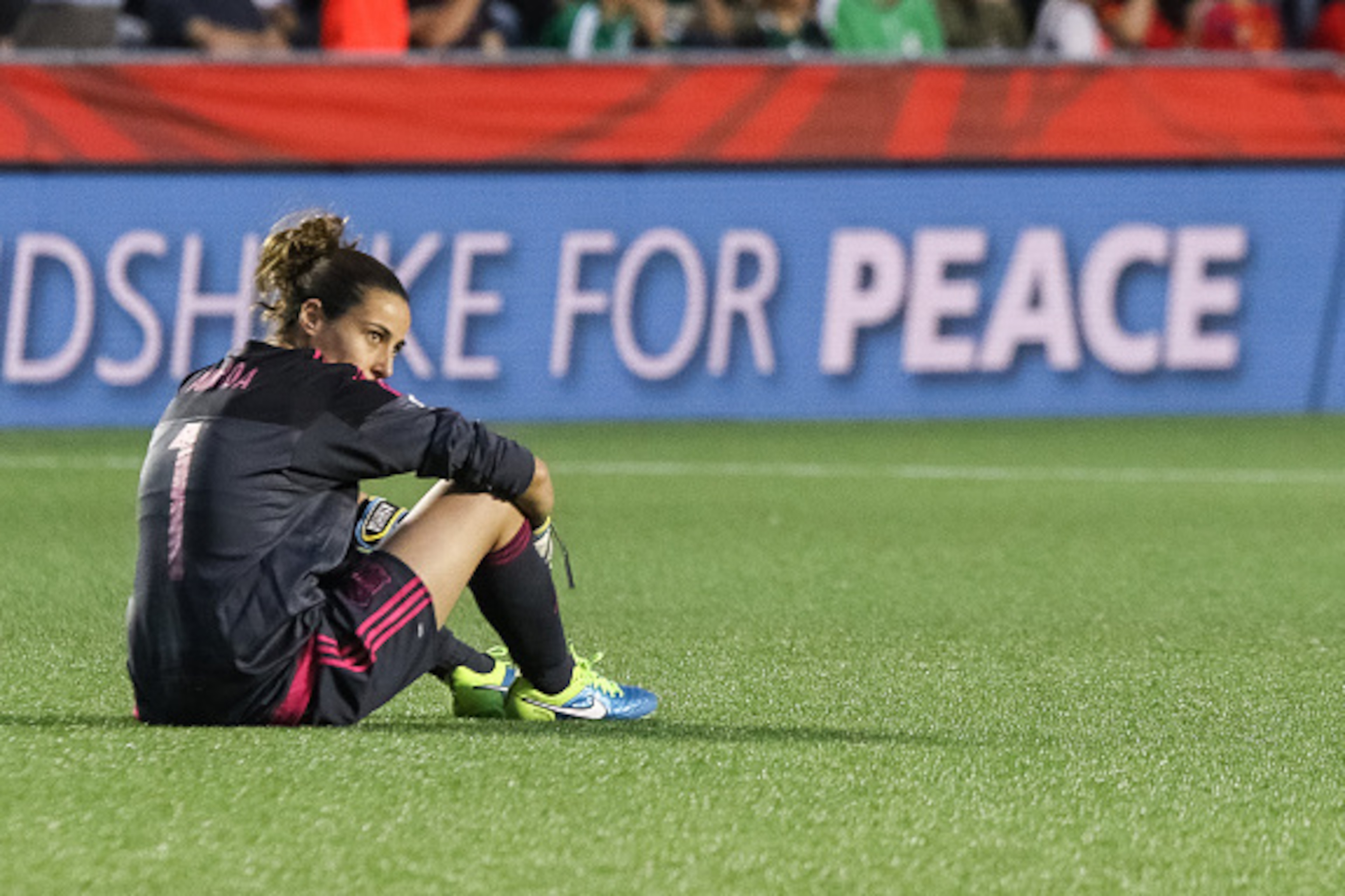 OTTAWA, ON - JUNE 17: Ainhoa Tirapu #1 of Spain sits on the pitch and looks on dejected after her team's loss in the FIFA Women's World Cup Canada 2015 Group E match between Korea Republic and Spain at Lansdowne Stadium on June 17, 2015 in Ottawa, Canada. OTTAWA, ON - JUNE 17: Ainhoa Tirapu #1 of Spain sits on the pitch and looks on dejected after her team's loss in the FIFA Women's World Cup Canada 2015 Group E match between Korea Republic and Spain at Lansdowne Stadium on June 17, 2015 in Ottawa, Canada.