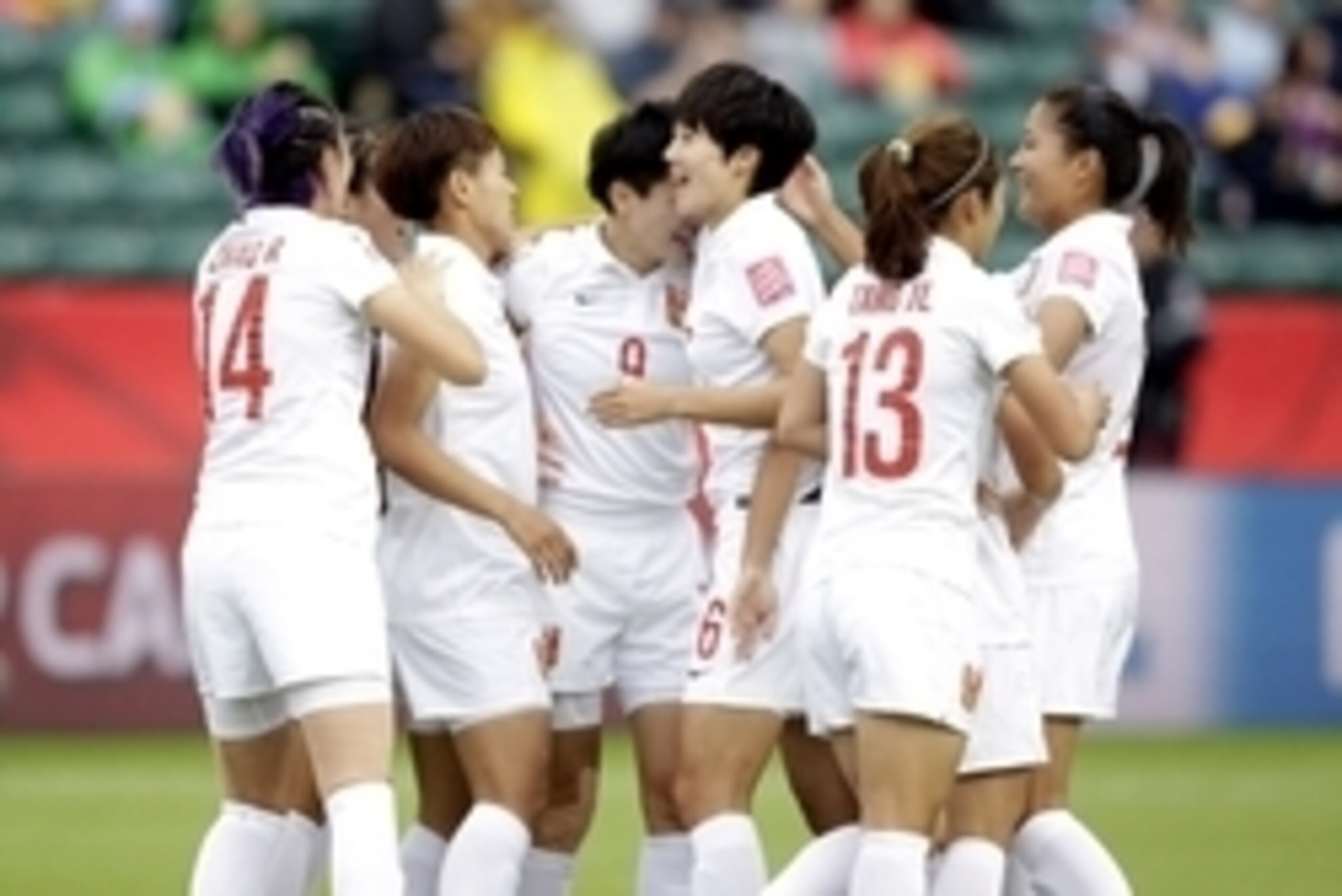 Jun 20, 2015; Edmonton, Alberta, CAN; China defender Wang Shanshan (9) celebrates a goal against Cameroon with teammates during the first half in the round of sixteen in the FIFA 2015 women's World Cup soccer tournament at Commonwealth Stadium. Mandatory 