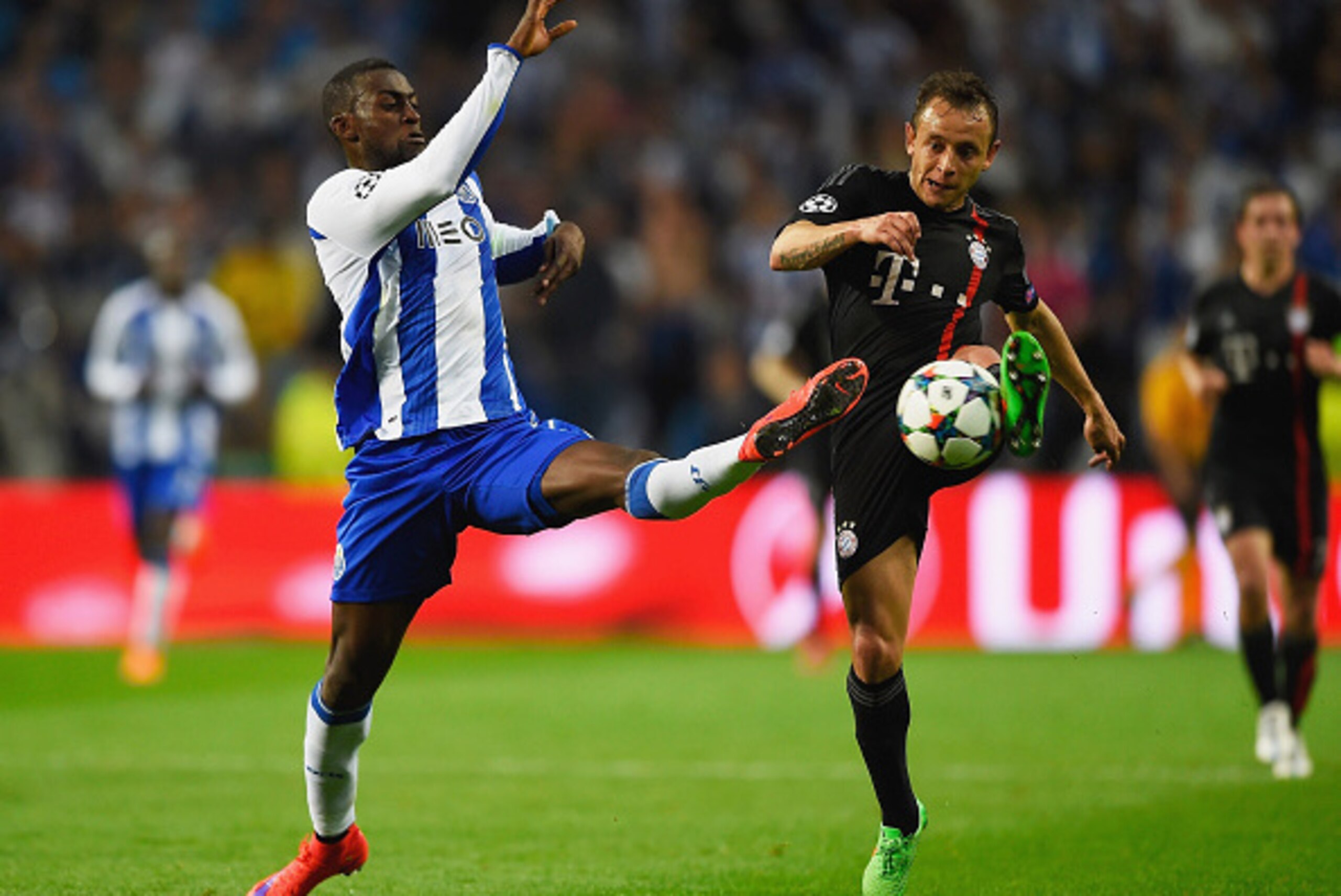 PORTO, PORTUGAL - APRIL 15:  Jackson Martinez of FC Porto challenges Rafinha of Bayern Muenchen during the UEFA Champions League Quarter Final first leg match between FC Porto and FC Bayern Muenchen at Estadio do Dragao on April 15, 2015 in Porto, Portuga