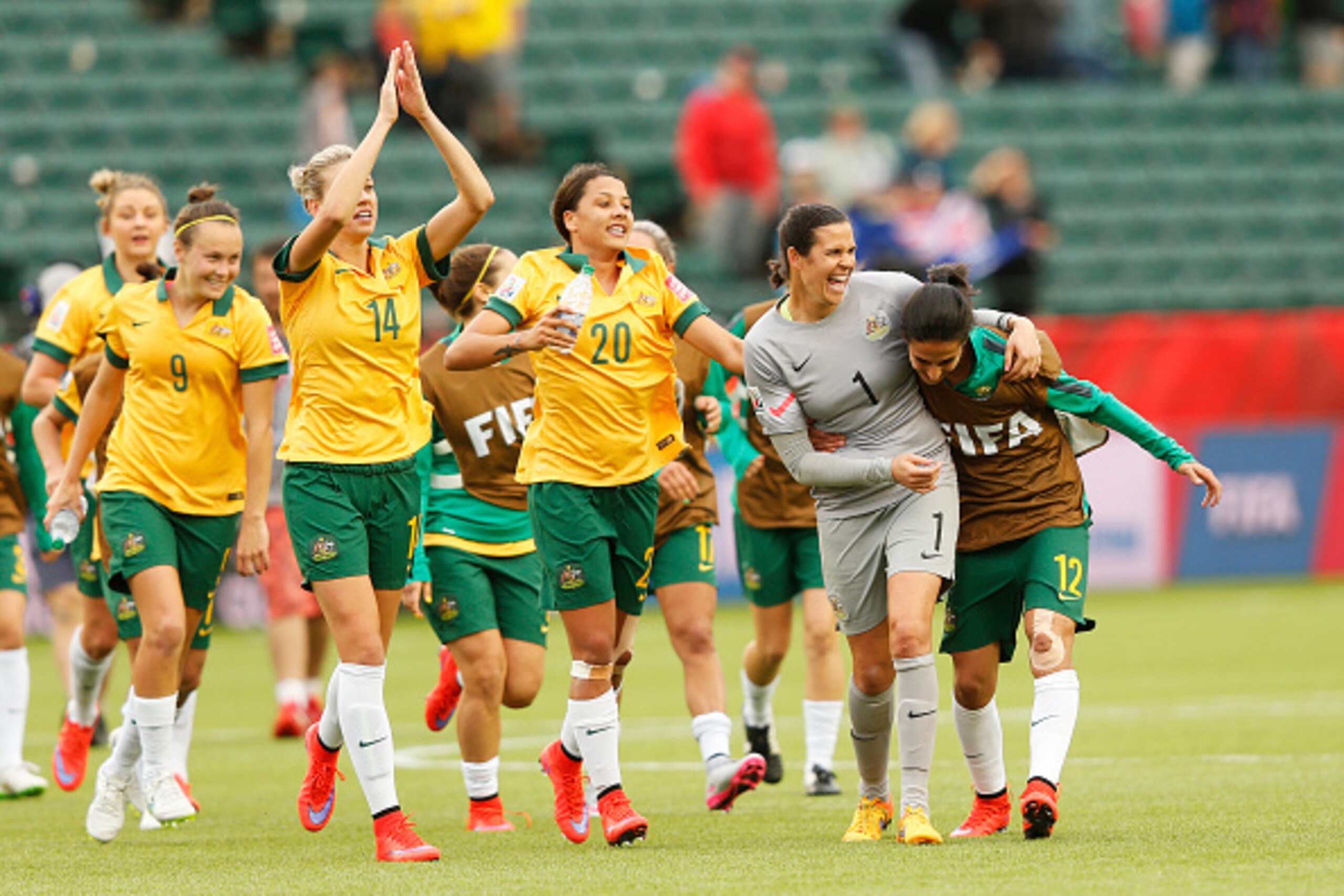 EDMONTON, AB - JUNE 16: Caitlin Foord #9, Alanna Kennedy #14, Samantha Kerr #20, Lydia Williams #1 and Leena Khamis #12 of Australia celebrate after a 1-1 game with Sweden during the FIFA Women's World Cup Canada Group D match between Australia and Sweden