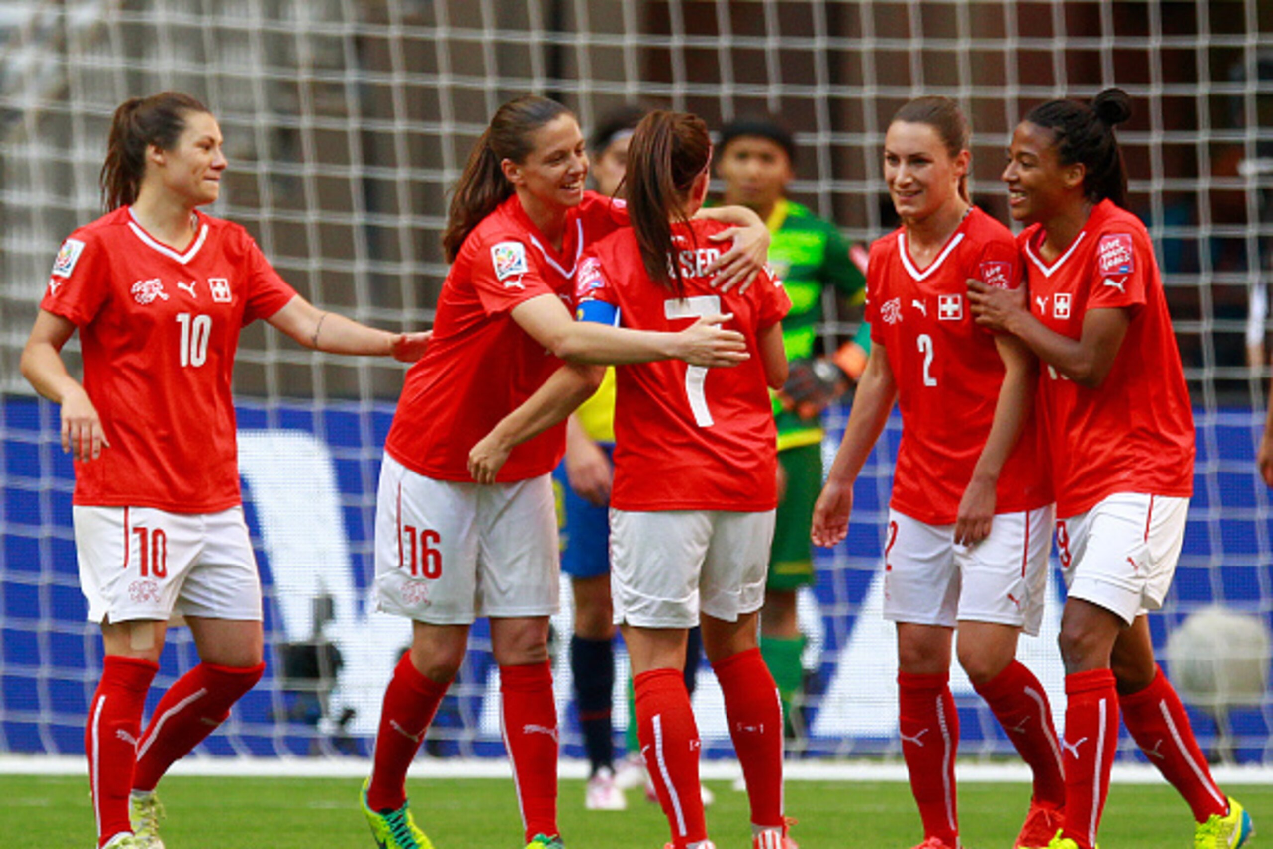 VANCOUVER, BC - JUNE 12: Martina Moser #7 of Switzerland is congratulated by teammate Fabienne Humm #16 after scoring during the FIFA Women's World Cup Canada 2015 Group C match between Switzerland and Ecuador June 12, 2015 at BC Place Stadium in Vancouve