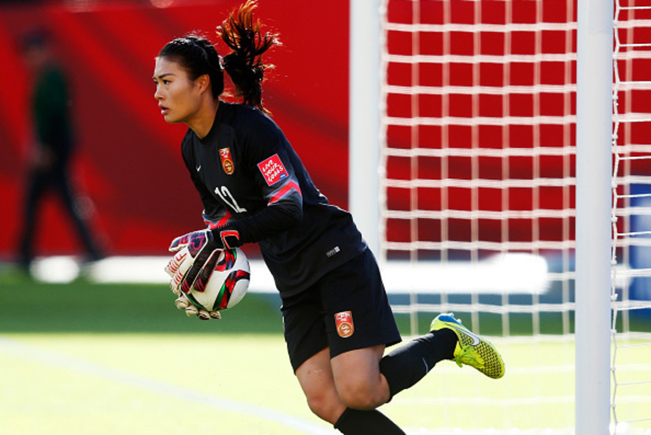 EDMONTON, AB - JUNE 20: Goalkeeper Wang Fei #12 of China makes a save during the FIFA Women's World Cup Canada Round 16 match between China and Cameroon at Commonwealth Stadium on June 20, 2015 in Edmonton, Alberta, Canada.  (Photo by Todd Korol/Getty Ima