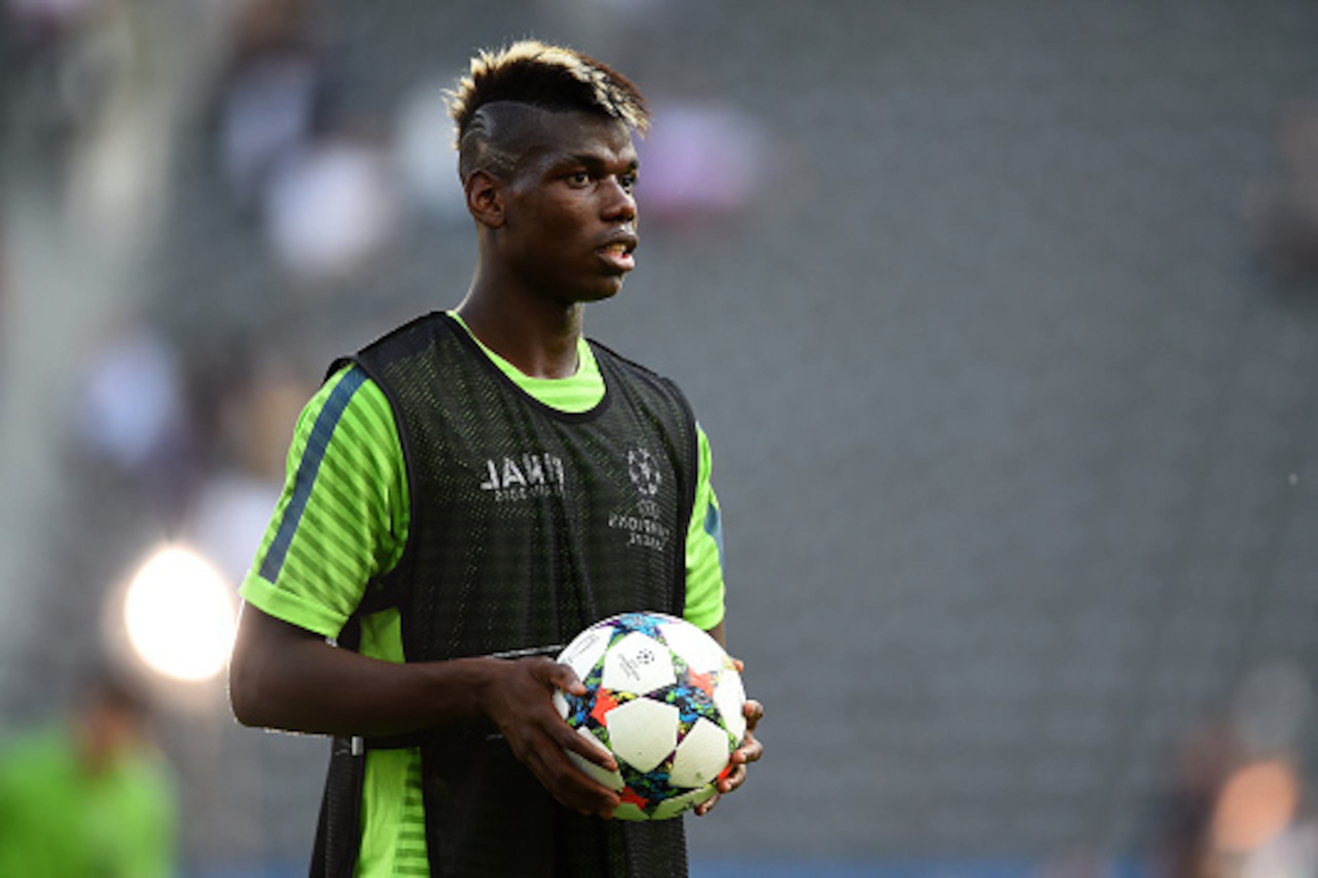 BERLIN, GERMANY - JUNE 05:  Paul Pogba of Juventus looks on during a Juventus training session on the eve of the UEFA Champions League Final match against FC Barcelona at Olympiastadion on June 5, 2015 in Berlin, Germany.  (Photo by Laurence Griffiths/Get