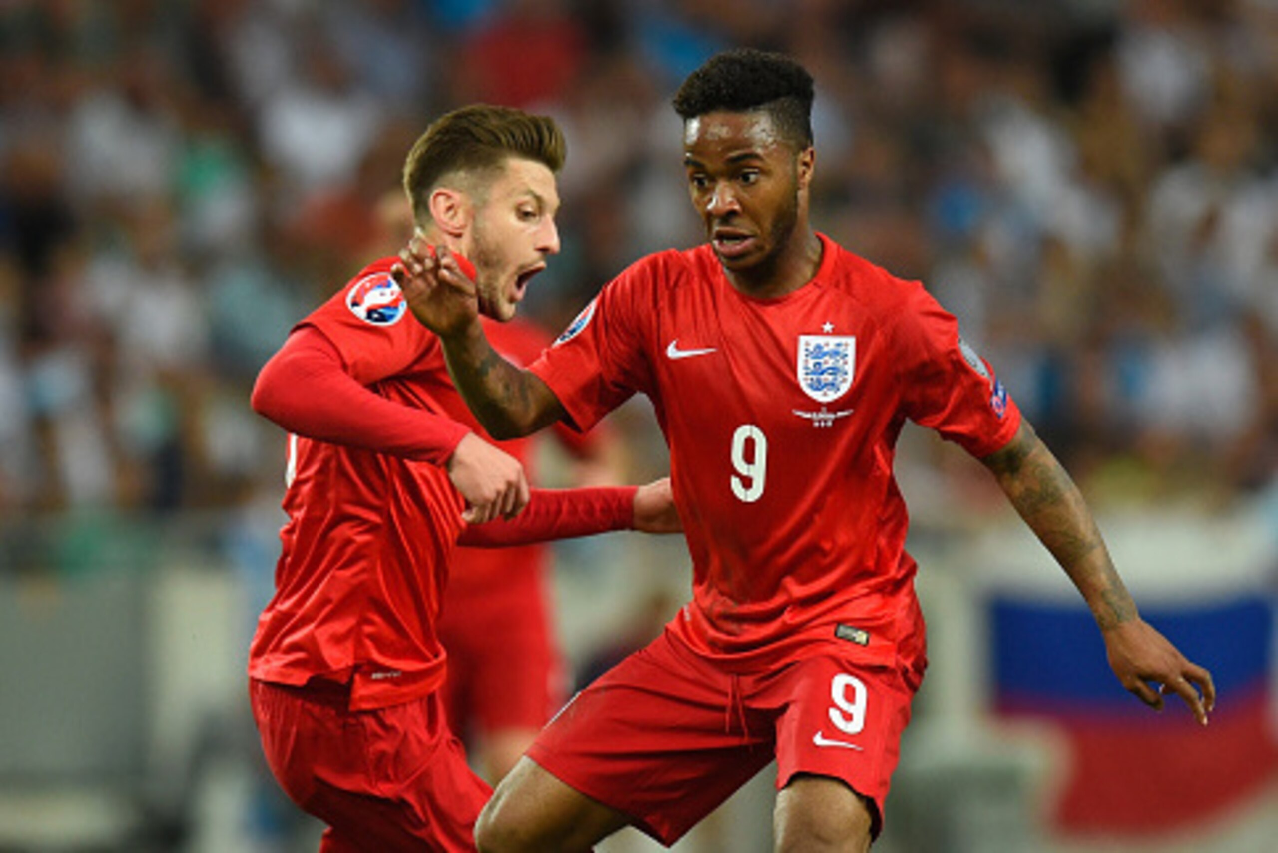 LJUBLJANA, SLOVENIA - JUNE 14:  England player Raheem Sterling (r) and Adam Lallana in action during the UEFA EURO 2016 Qualifier between Slovenia and England on at the Stozice Arena on June 14, 2015 in Ljubljana, Slovenia.  (Photo by Stu Forster/Getty Im