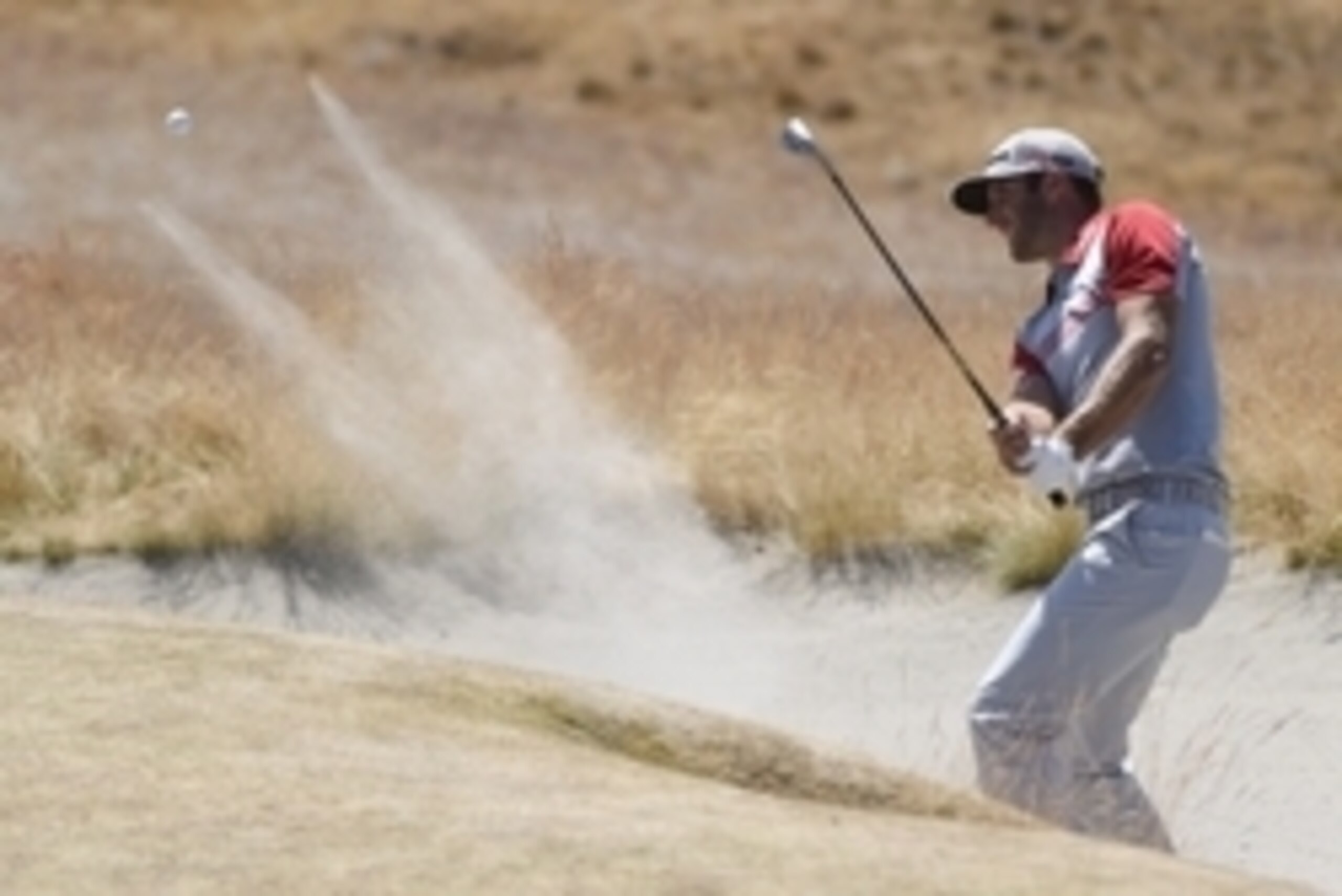 Jun 20, 2015; University Place, WA, USA; Dustin Johnson hits out of a bunker in the third round of the 2015 U.S. Open golf tournament at Chambers Bay. Mandatory Credit: Kyle Terada-USA TODAY Sports