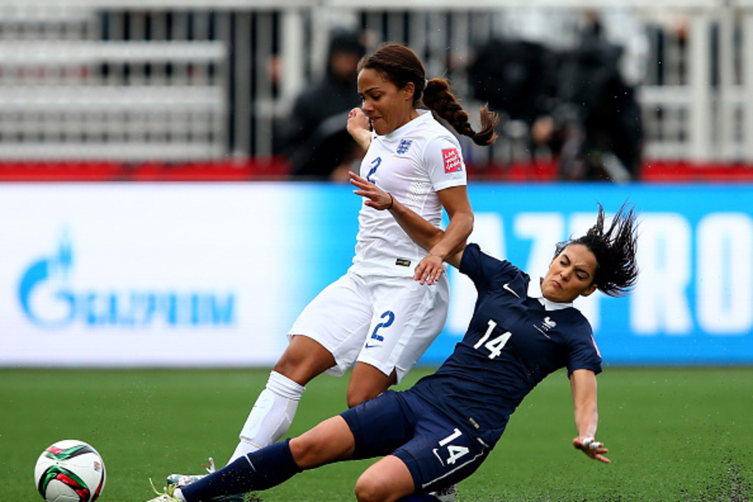 MONCTON, NB - JUNE 09:  Louisa Necib #14 of France knocks the ball away from Alex Scott #2 of England during the FIFA Women's World Cup 2015 Group F match at Moncton Stadium on June 9, 2015 in Moncton, Canada.  (Photo by Elsa/Getty Images)
