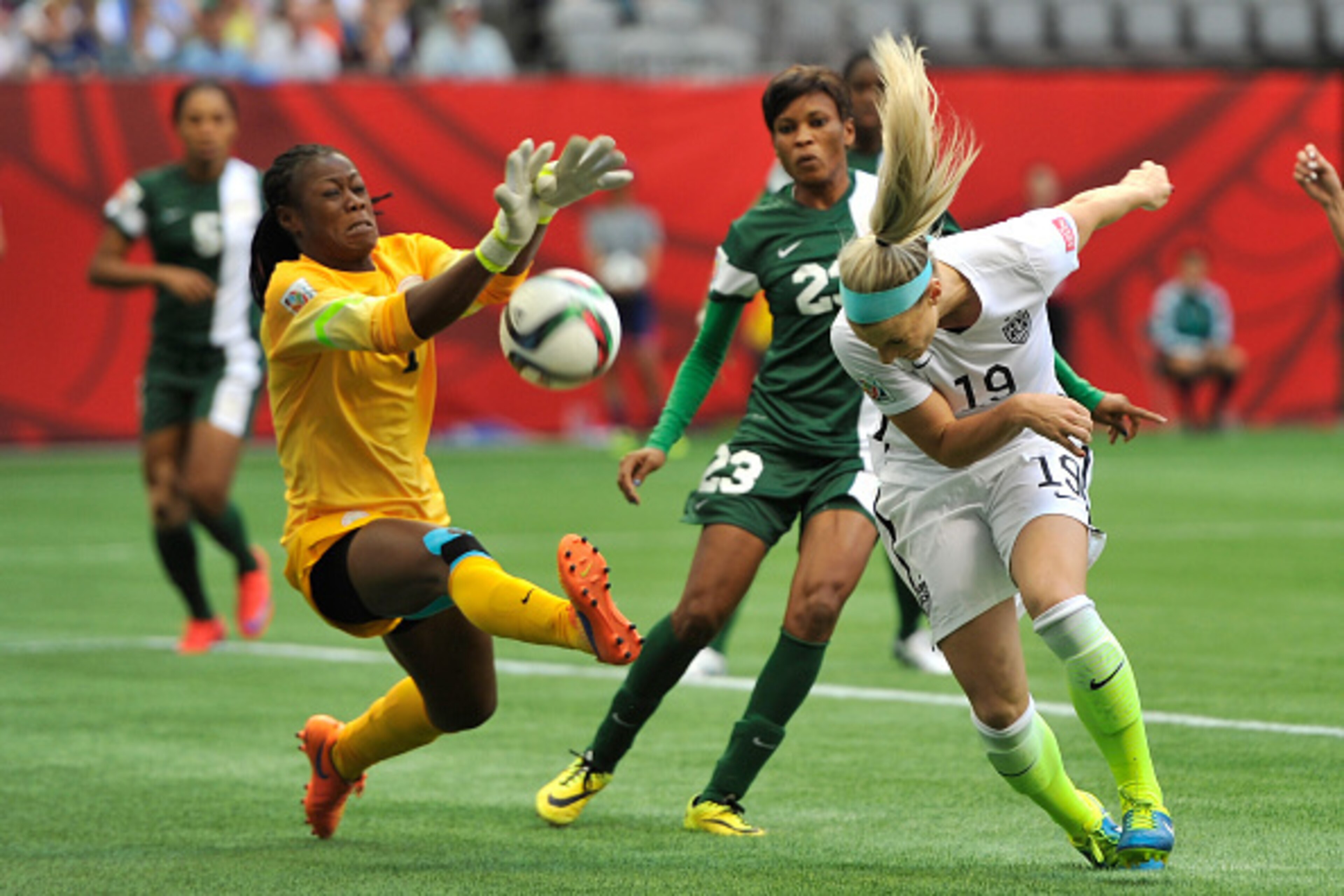 VANCOUVER, BC - JUNE 16:  Julie Johnston #19 of the United States takes a shot against goalkeeper Precious Dede #1 of Nigeria in the first half in the Group D match of the FIFA Women's World Cup Canada 2015 at BC Place Stadium on June 16, 2015 in Vancouve