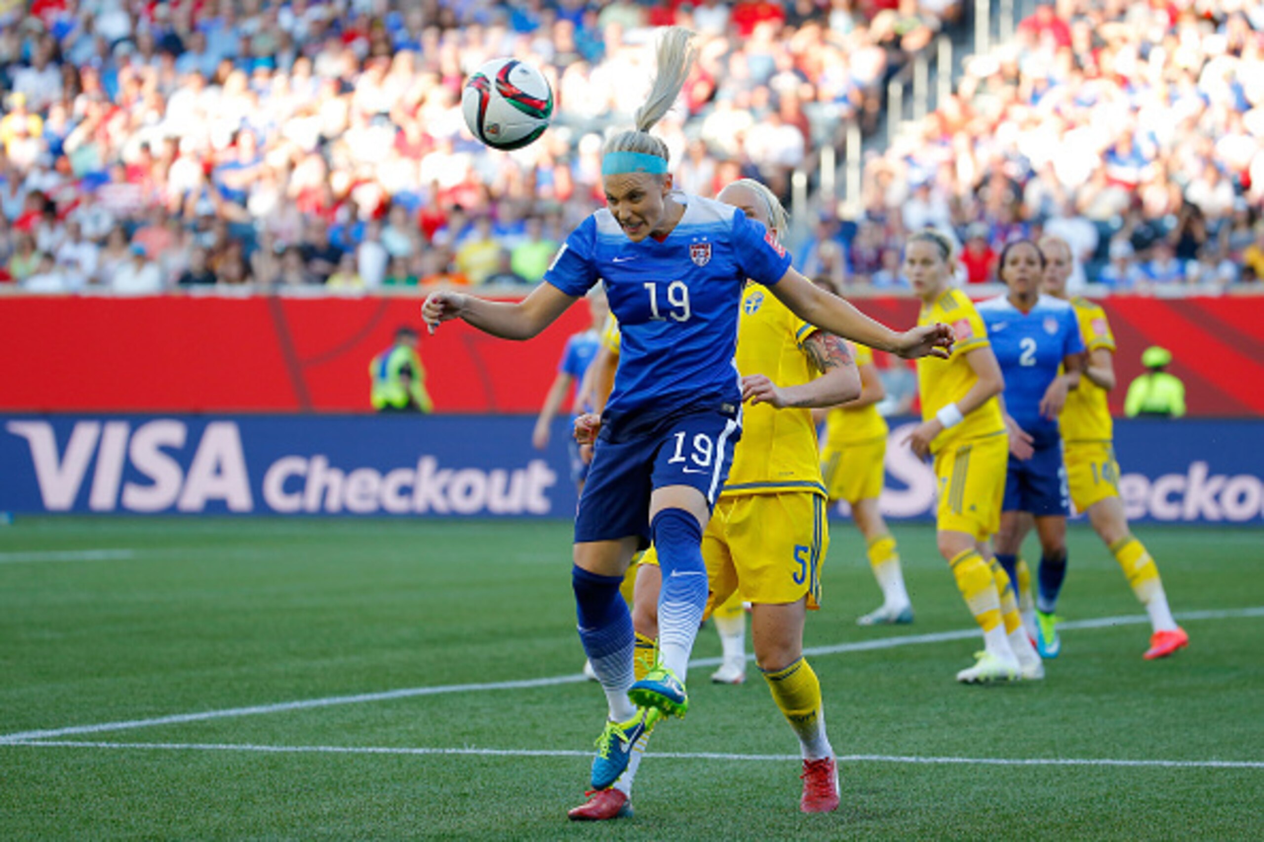 WINNIPEG, MB - JUNE 12:  Julie Johnston #19 of the United States heads the ball in front of Nilla Fischer #5 of Sweden in the FIFA Women's World Cup Canada 2015 match at Winnipeg Stadium on June 12, 2015 in Winnipeg, Canada.  (Photo by Kevin C. Cox/Getty 