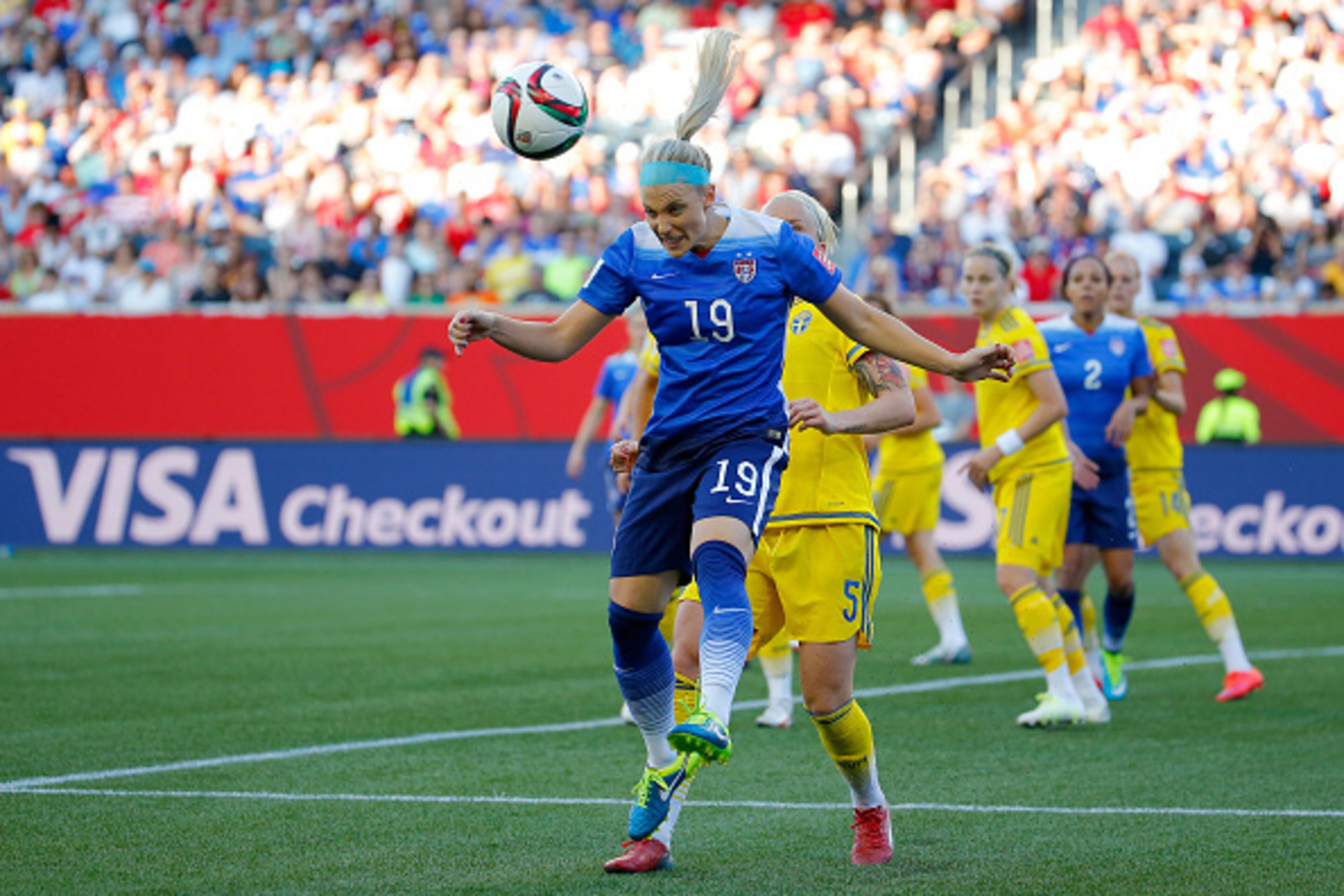 WINNIPEG, MB - JUNE 12:  Julie Johnston #19 of the United States heads the ball in front of Nilla Fischer #5 of Sweden in the FIFA Women's World Cup Canada 2015 match at Winnipeg Stadium on June 12, 2015 in Winnipeg, Canada.  (Photo by Kevin C. Cox/Getty 