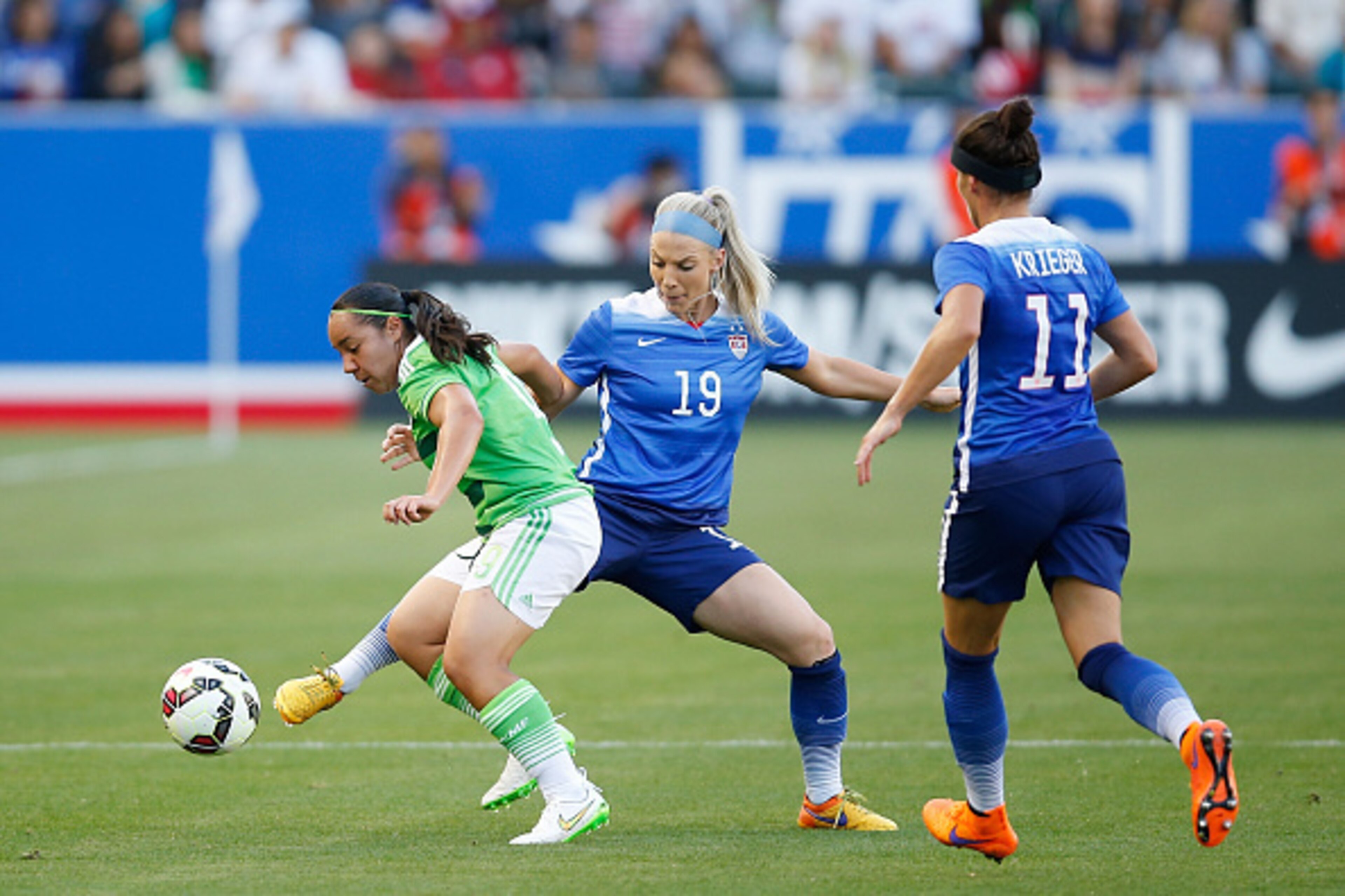 LOS ANGELES, CA - MAY 17:  Defender Julie Johnston #19 of USA reaches for the ball past Forward Charlyn Corral #9 of Mexico in the first half during their international friendly match at StubHub Center on May 17, 2015 in Los Angeles, California.  (Photo b