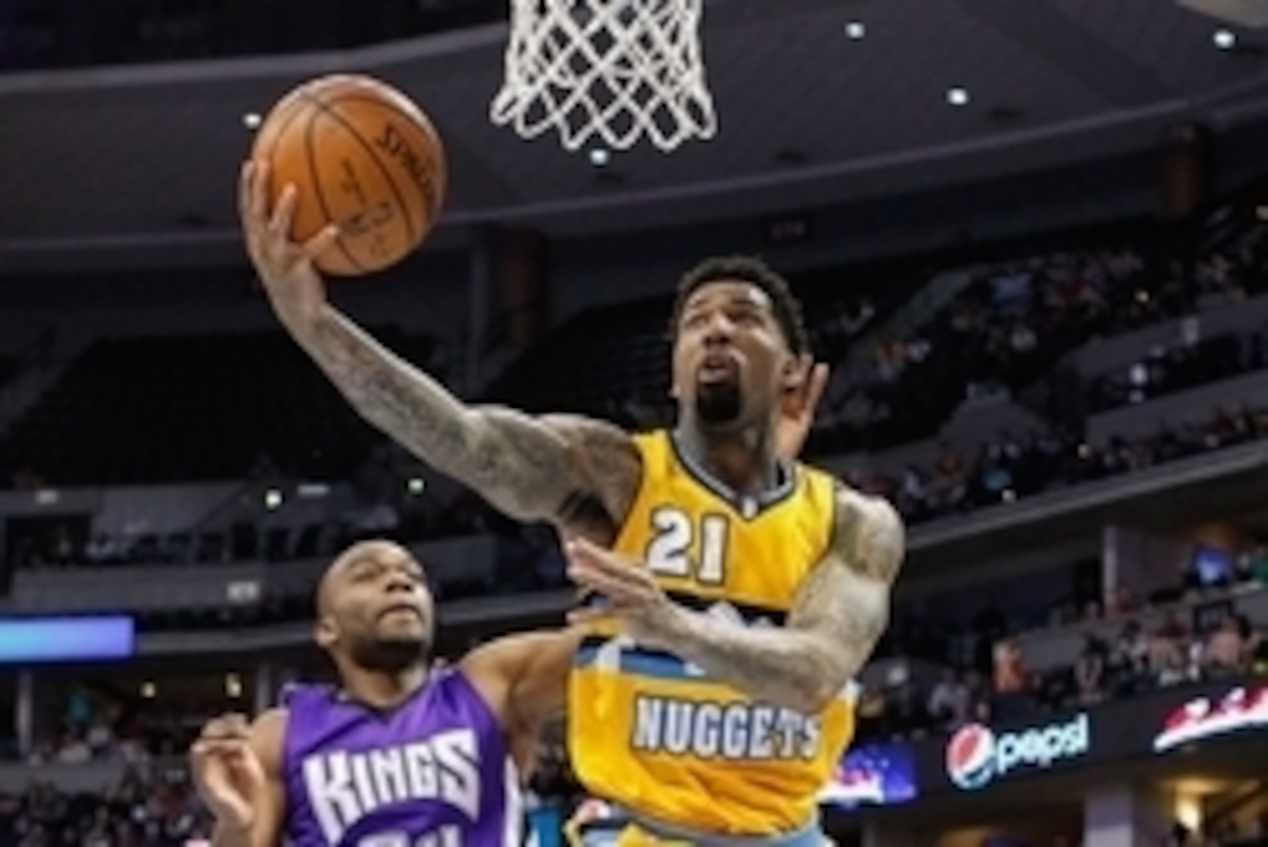 Apr 12, 2015; Denver, CO, USA; Denver Nuggets forward Wilson Chandler (21) takes a shot against Sacramento Kings forward Carl Landry (24) in the third quarter at Pepsi Center. The Nuggets defeated the Kings 122-111. Mandatory Credit: Isaiah J. Downing-USA