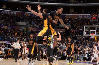 LOS ANGELES, CA -  FEBRUARY 27: Wayne Ellington #2 and Ed Davis #21 of the Los Angeles Lakers celebrates during the game against the Milwaukee Bucks on February 27, 2015 at STAPLES Center in Los Angeles, California. NOTE TO USER: User expressly acknowledg