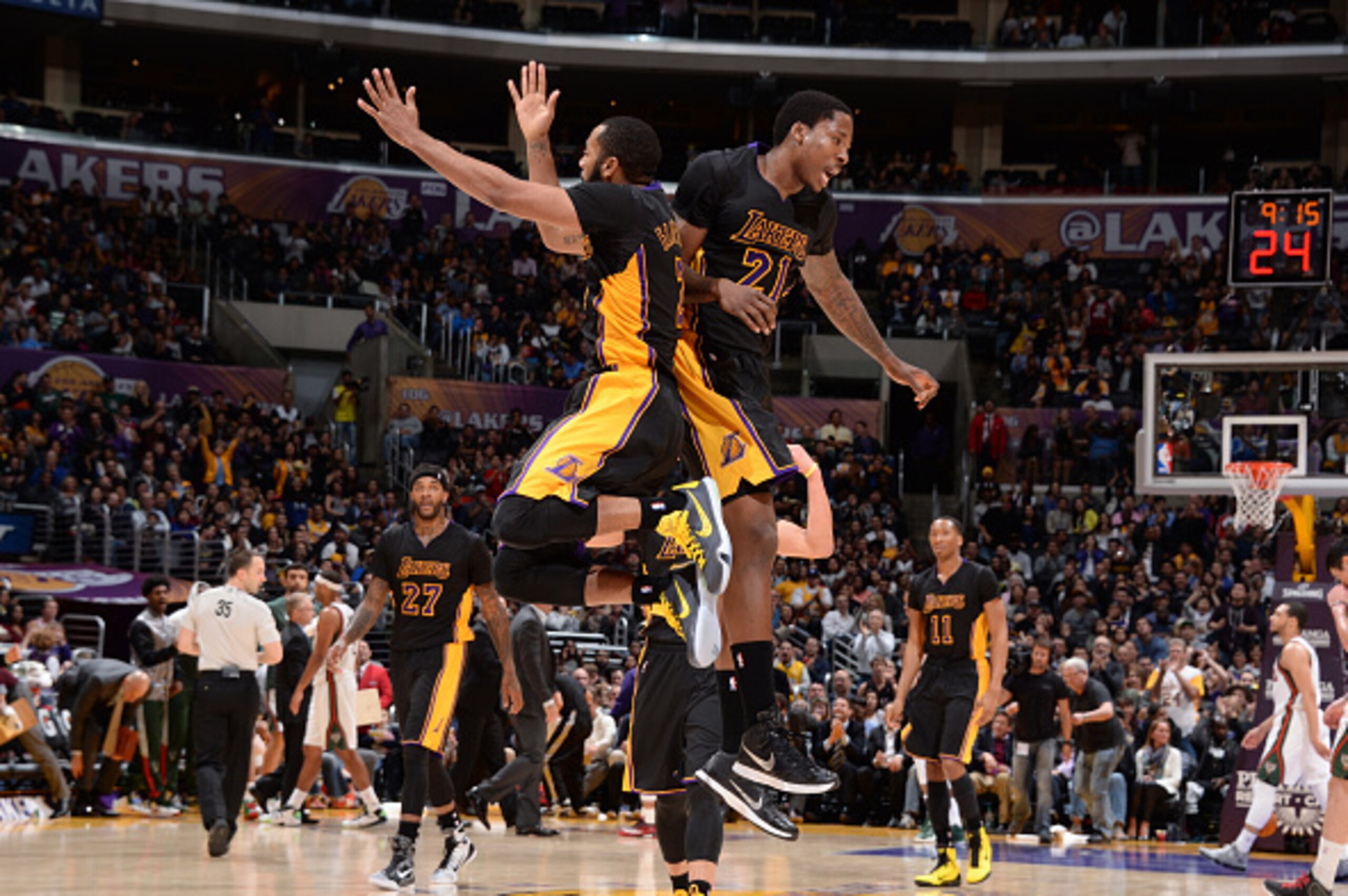 LOS ANGELES, CA -  FEBRUARY 27: Wayne Ellington #2 and Ed Davis #21 of the Los Angeles Lakers celebrates during the game against the Milwaukee Bucks on February 27, 2015 at STAPLES Center in Los Angeles, California. NOTE TO USER: User expressly acknowledg