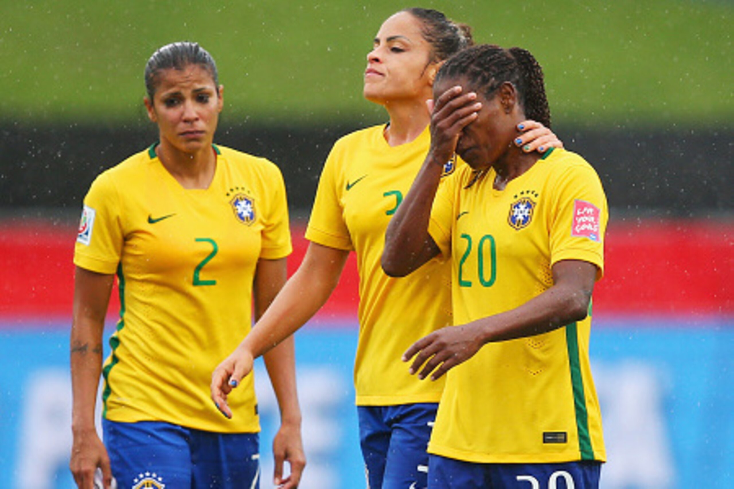 MONCTON, NB - JUNE 21: (L-R) Fabiana, Monica and Formiga of Brazil look dejected in defeat after the FIFA Women's World Cup 2015 round of 16 match between Brazil and Australia at Moncton Stadium on June 21, 2015 in Moncton, Canada. Australia reach the qua