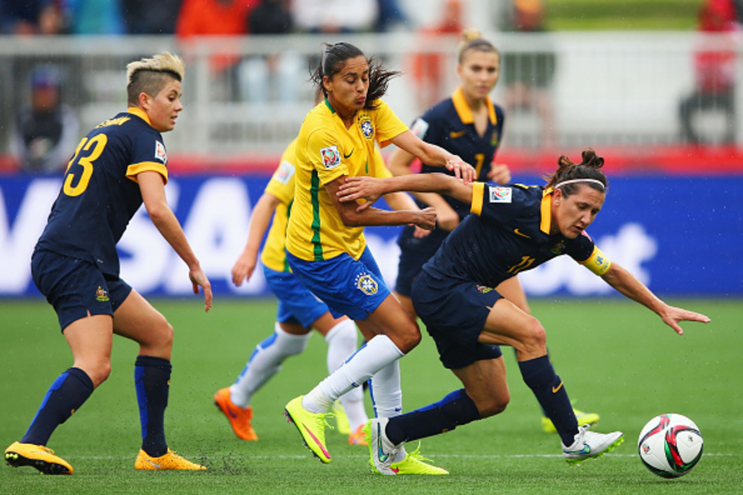 MONCTON, NB - JUNE 21:  Lisa De Vanna of Australia holds off Andressa of Brazil during the FIFA Women's World Cup 2015 round of 16 match between Brazil and Australia at Moncton Stadium on June 21, 2015 in Moncton, Canada.  (Photo by Elsa/Getty Images)
