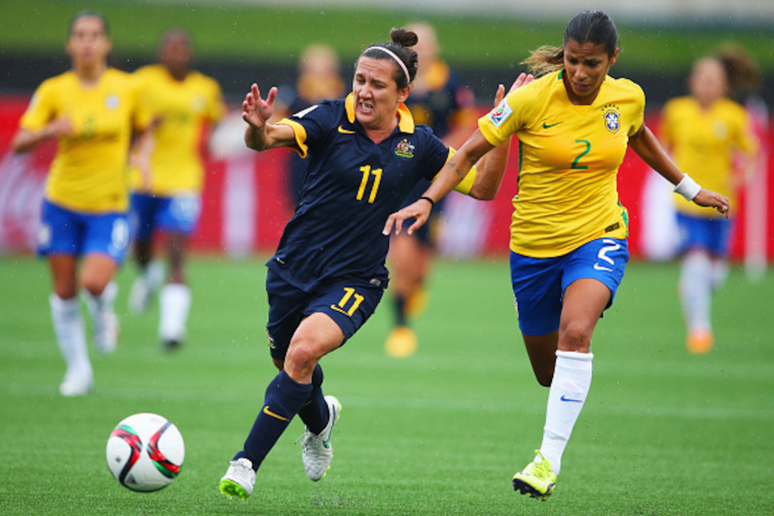 MONCTON, NB - JUNE 21:  Lisa De Vanna of Australia is chased by Fabiana of Brazil during the FIFA Women's World Cup 2015 round of 16 match between Brazil and Australia at Moncton Stadium on June 21, 2015 in Moncton, Canada.  (Photo by Elsa/Getty Images)