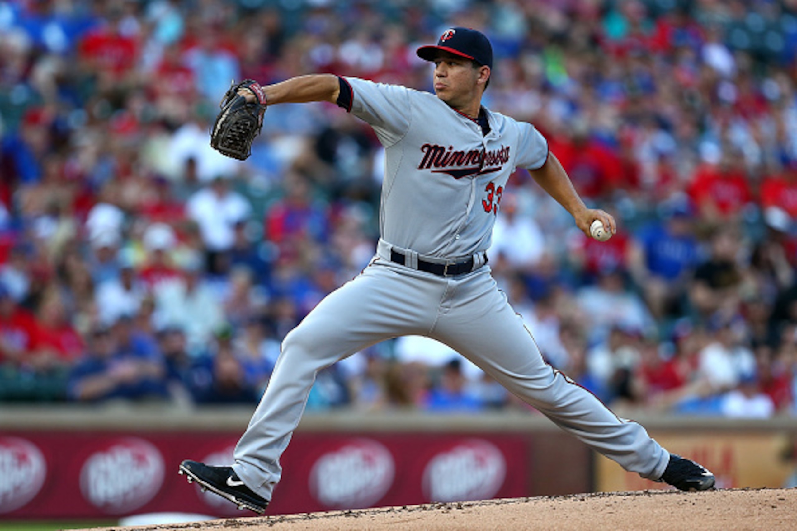ARLINGTON, TX - JUNE 12: Tommy Milone #33 of the Minnesota Twins pitches in the first inning during a game against the Texas Rangers at Globe Life Park in Arlington on June 12, 2015 in Arlington, Texas.  (Photo by Sarah Crabill/Getty Images)