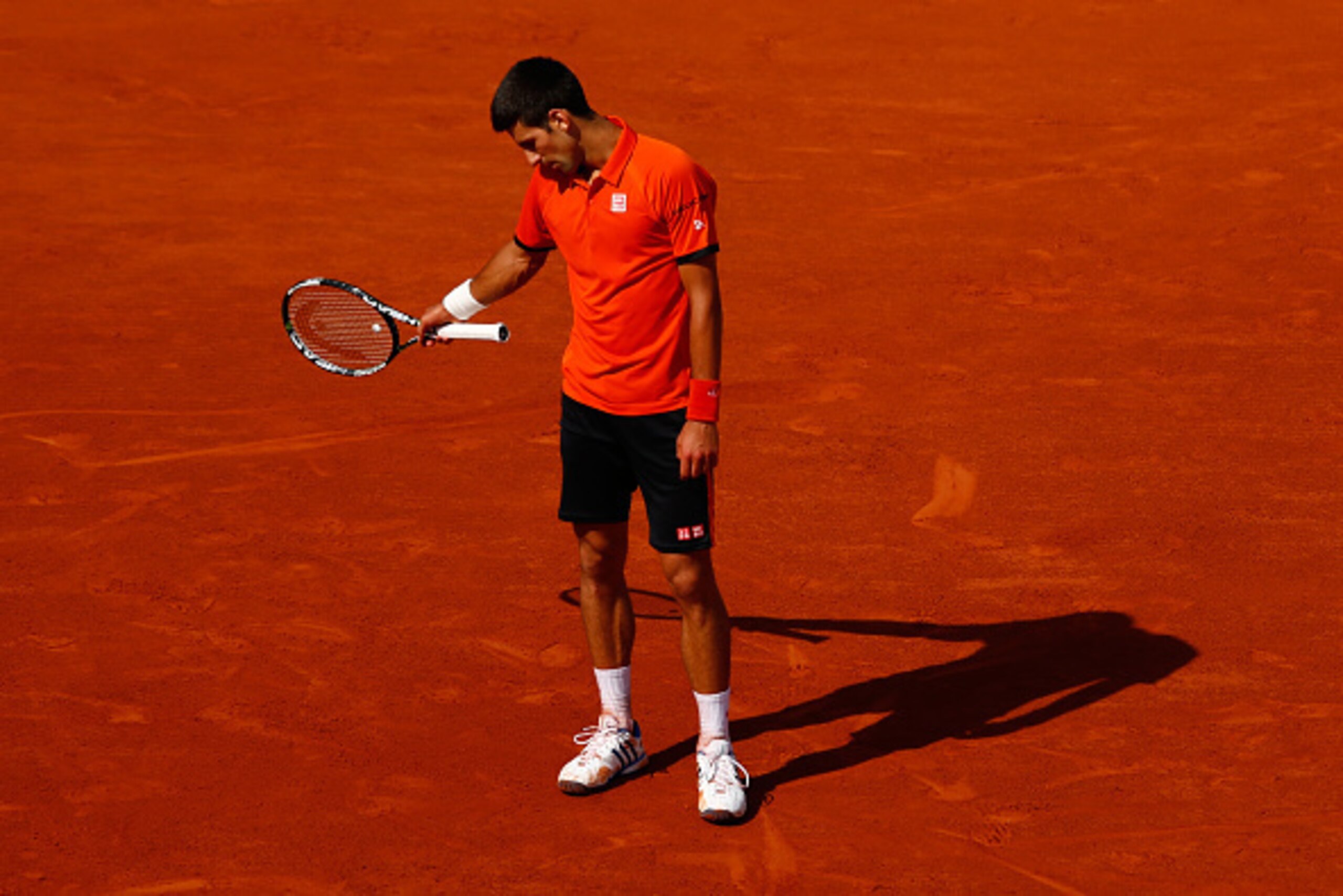 PARIS, FRANCE - JUNE 07:  Novak Djokovic of Serbia reacts in the Men's Singles Final against Stanislas Wawrinka of Switzerland on day fifteen of the 2015 French Open at Roland Garros on June 7, 2015 in Paris, France.  (Photo by Julian Finney/Getty Images)