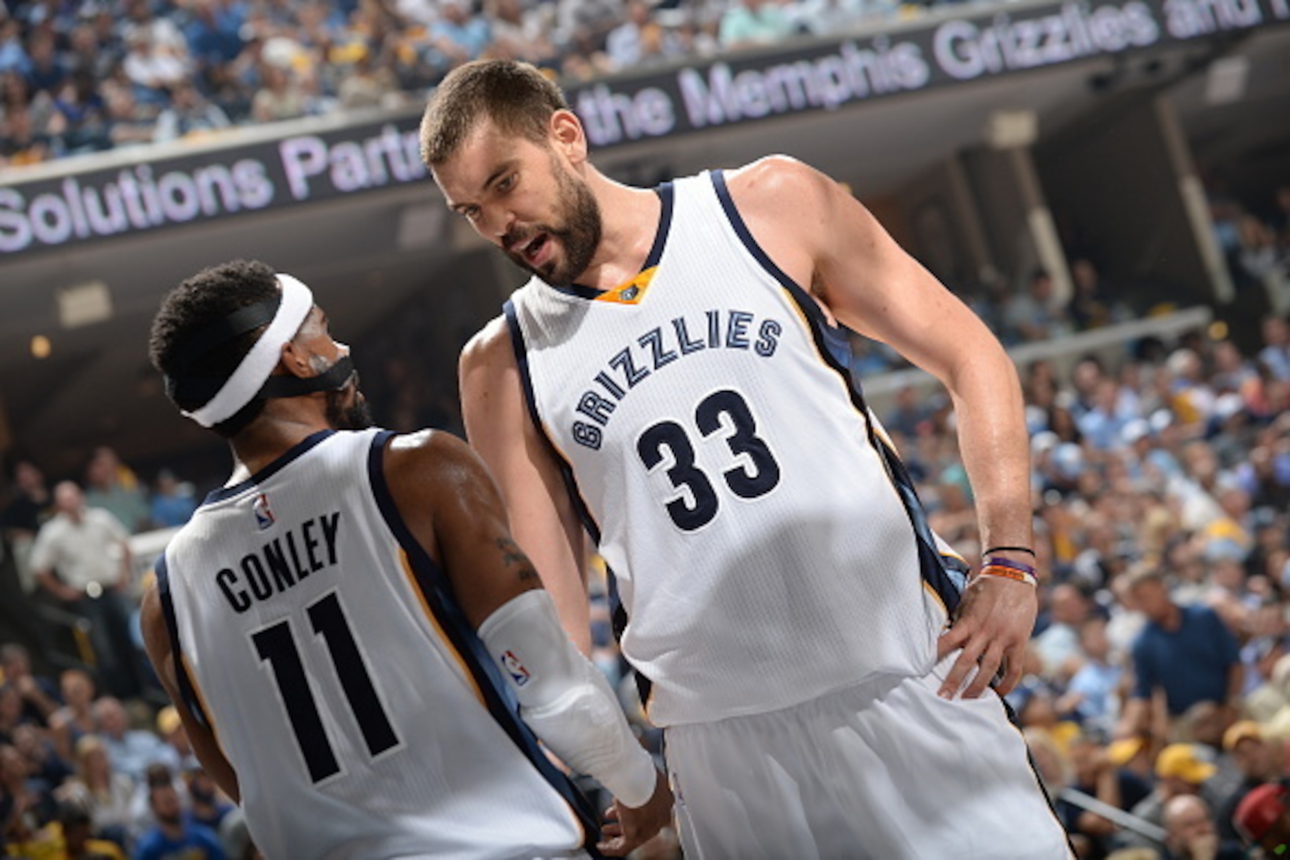 MEMPHIS, TN - MAY 9:  Marc Gasol #33 of the Memphis Grizzlies talks with teammate Mike Conley #11 against the Golden State Warriors in Game Three of the Western Conference Semifinals during the 2015 NBA Playoffs on May 9, 2015 at the FedExForum in Memphis