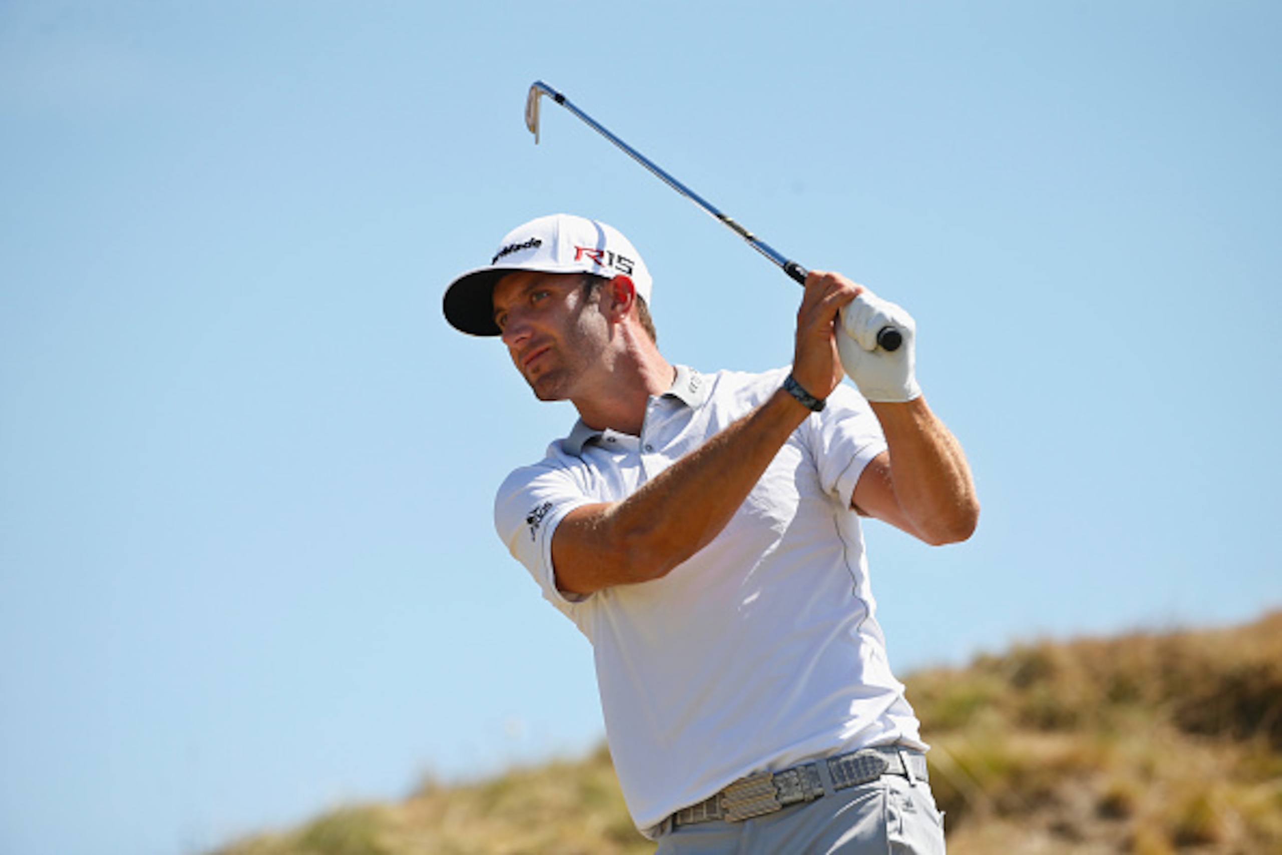 UNIVERSITY PLACE, WA - JUNE 21:  Dustin Johnson of the United States watches his tee shot on the second hole during the final round of the 115th U.S. Open Championship at Chambers Bay on June 21, 2015 in University Place, Washington.  (Photo by Ezra Shaw/