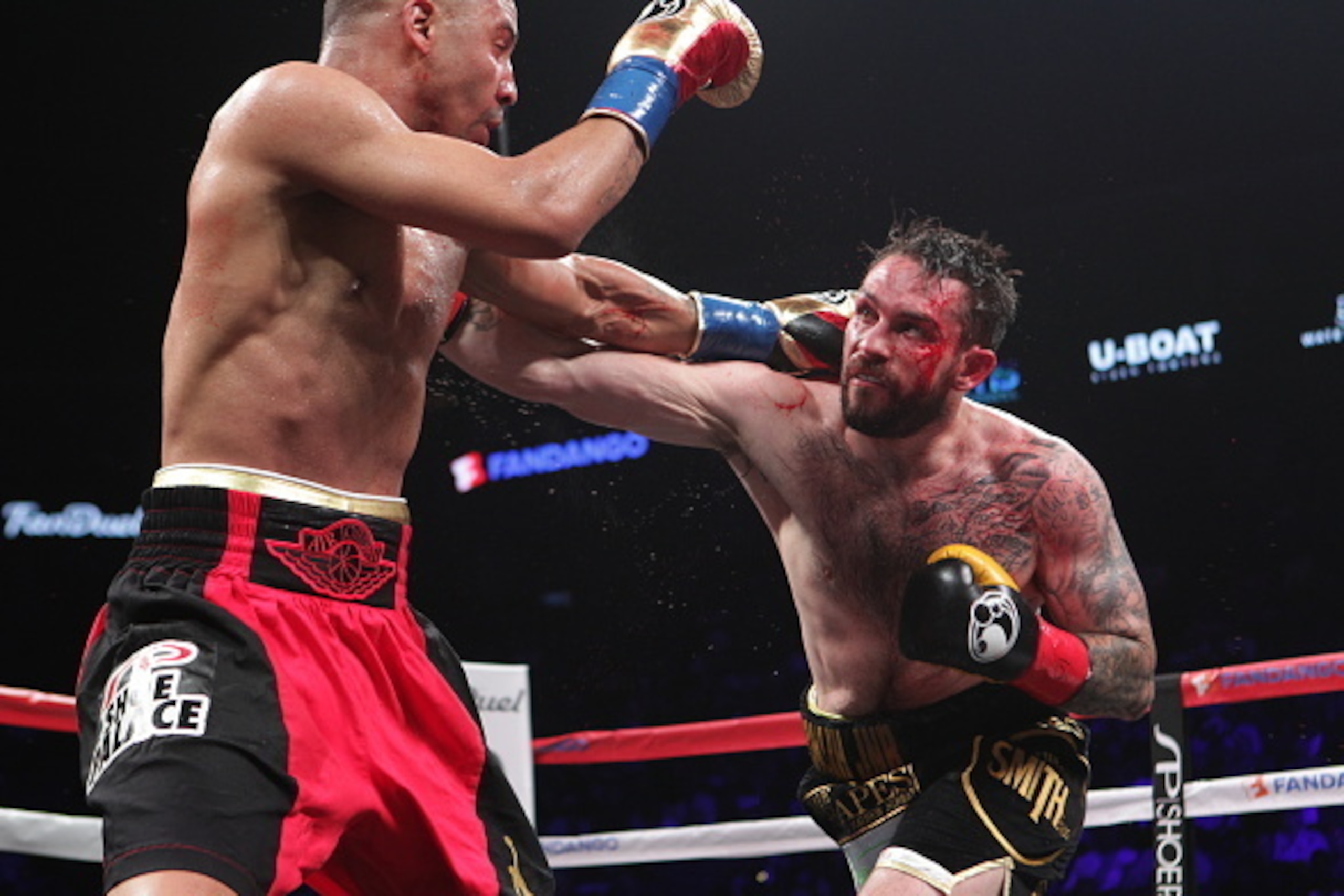 OAKLAND, CA - JUNE 20: Andre Ward (L) and Paul Smith exchange blows during their Cruiserweight fight at ORACLE Arena on June 20, 2015 in Oakland, California. (Photo by Alexis Cuarezma/Getty Images)