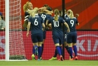 June 21, 2015; Montreal, Quebec, CAN; France celebrate the goal scored by forward Marie Laure (18) against Korea Republic during the second half in the round of sixteen in the FIFA 2015 women's World Cup soccer tournament at Olympic Stadium. Mandatory Cre