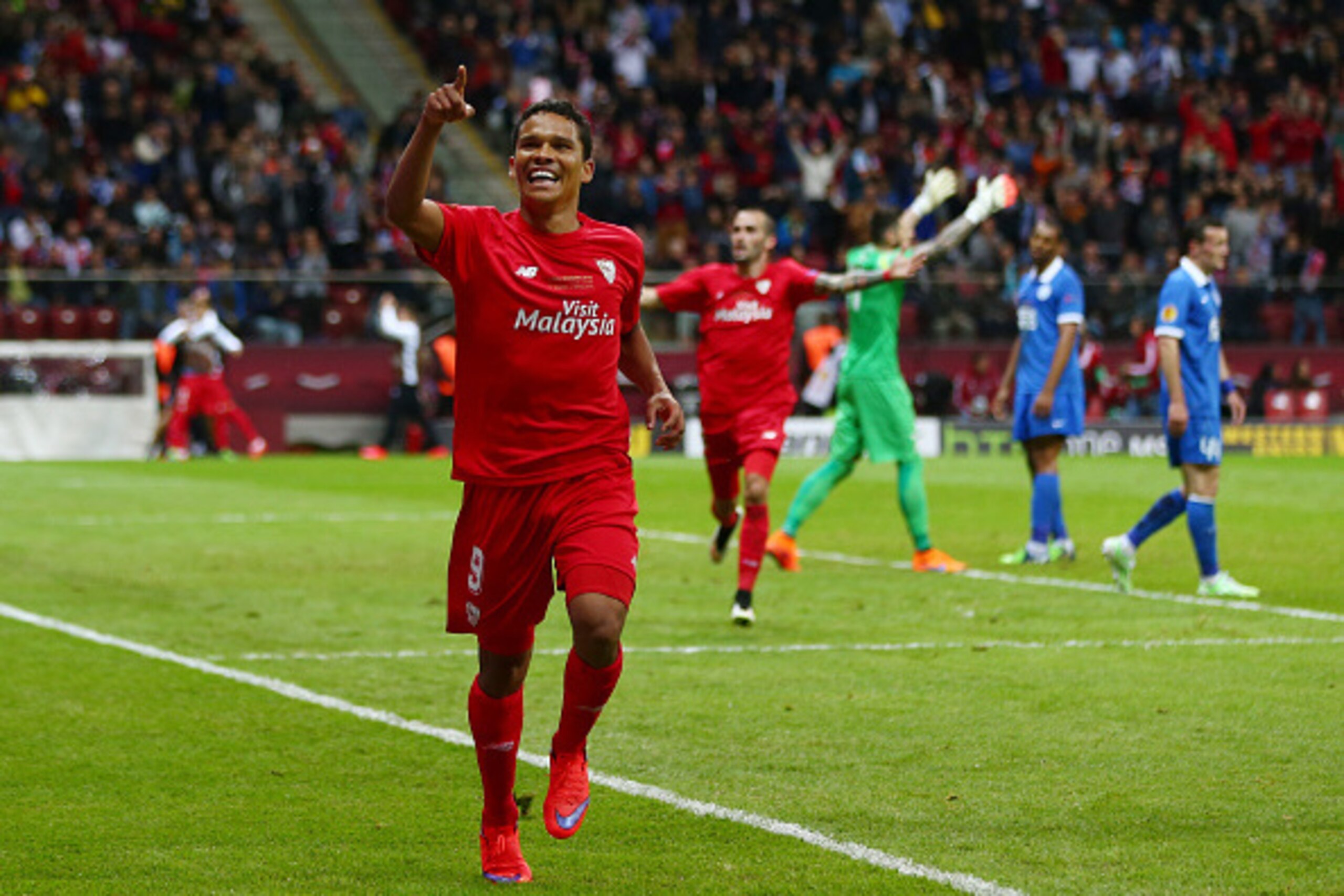 WARSAW, POLAND - MAY 27:  Carlos Bacca of Sevilla celebrates scoring his team's third goal during the UEFA Europa League Final match between FC Dnipro Dnipropetrovsk and FC Sevilla on May 27, 2015 in Warsaw, Poland.  (Photo by Michael Steele/Getty Images)