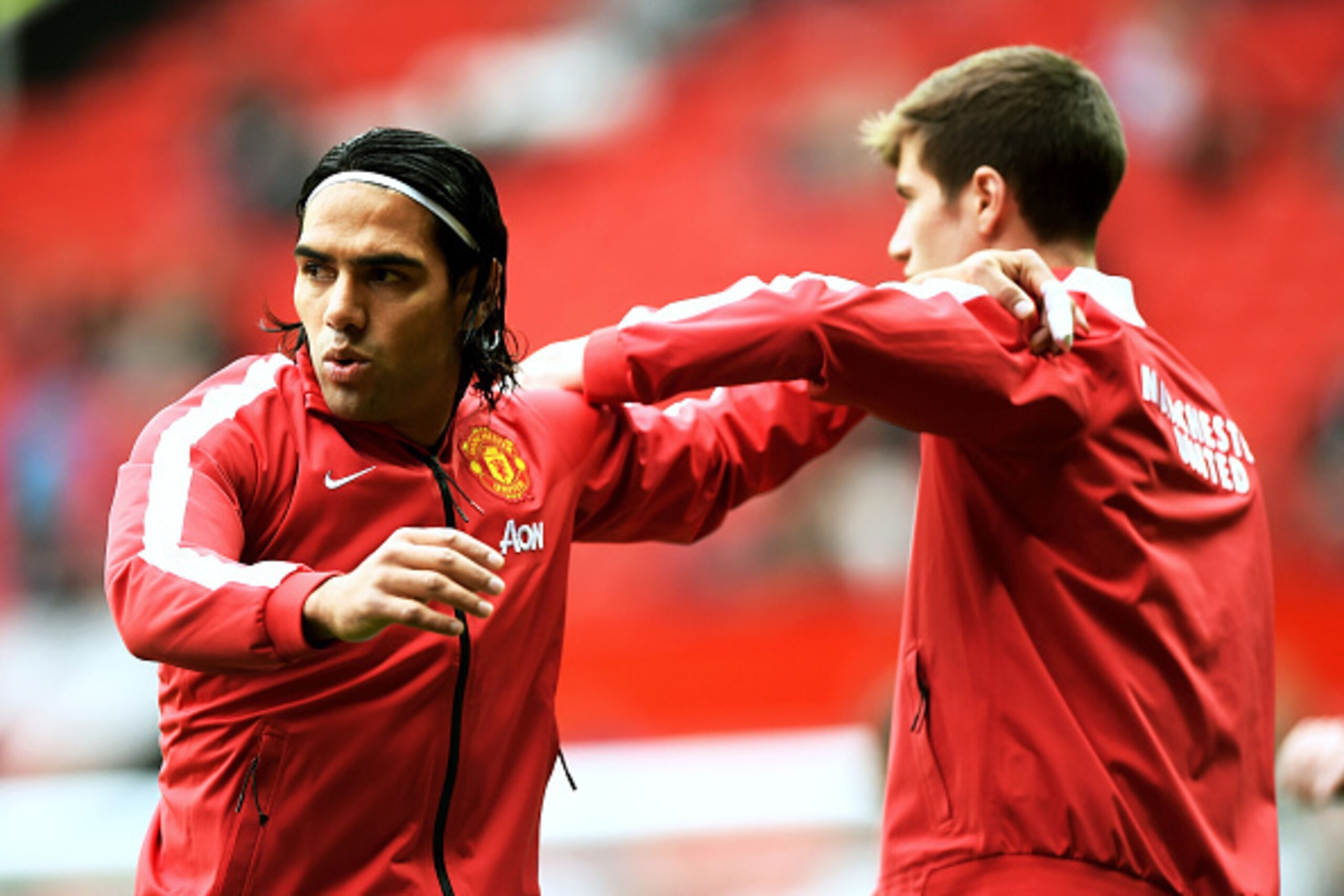 MANCHESTER, ENGLAND - SEPTEMBER 27:  Radamel Falcao Garcia of Manchester United warms up with team-mate Paddy McNair before the Barclays Premier League match between Manchester United and West Ham United at Old Trafford on September 27, 2014 in Manchester