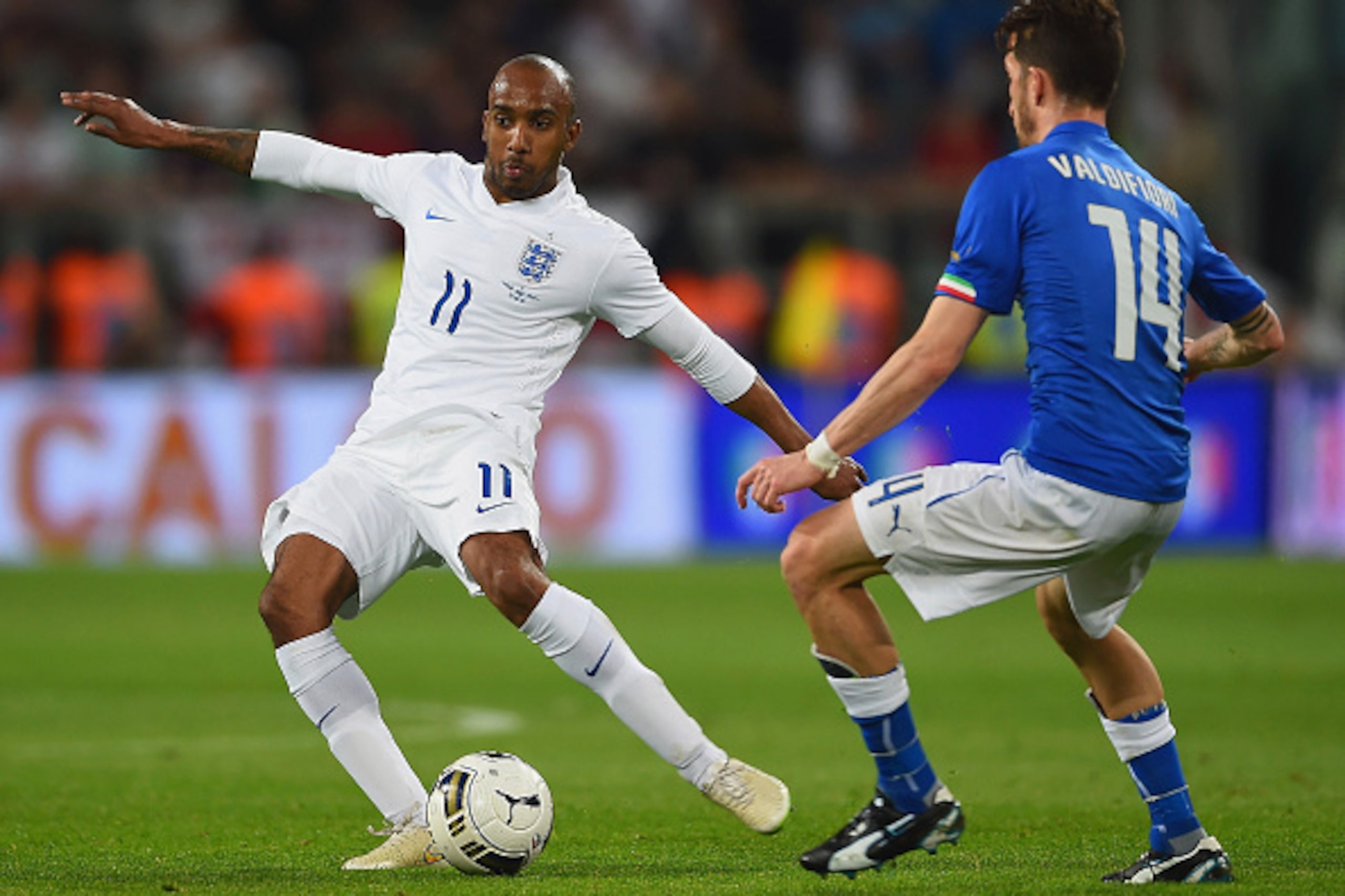 TURIN, ITALY - MARCH 31:  Fabian Delph of England is challenged by Mirko Valdifiori of Italy during the international friendly match between Italy and England at the Juventus Arena on March 31, 2015 in Turin, Italy.  (Photo by Laurence Griffiths/Getty Ima